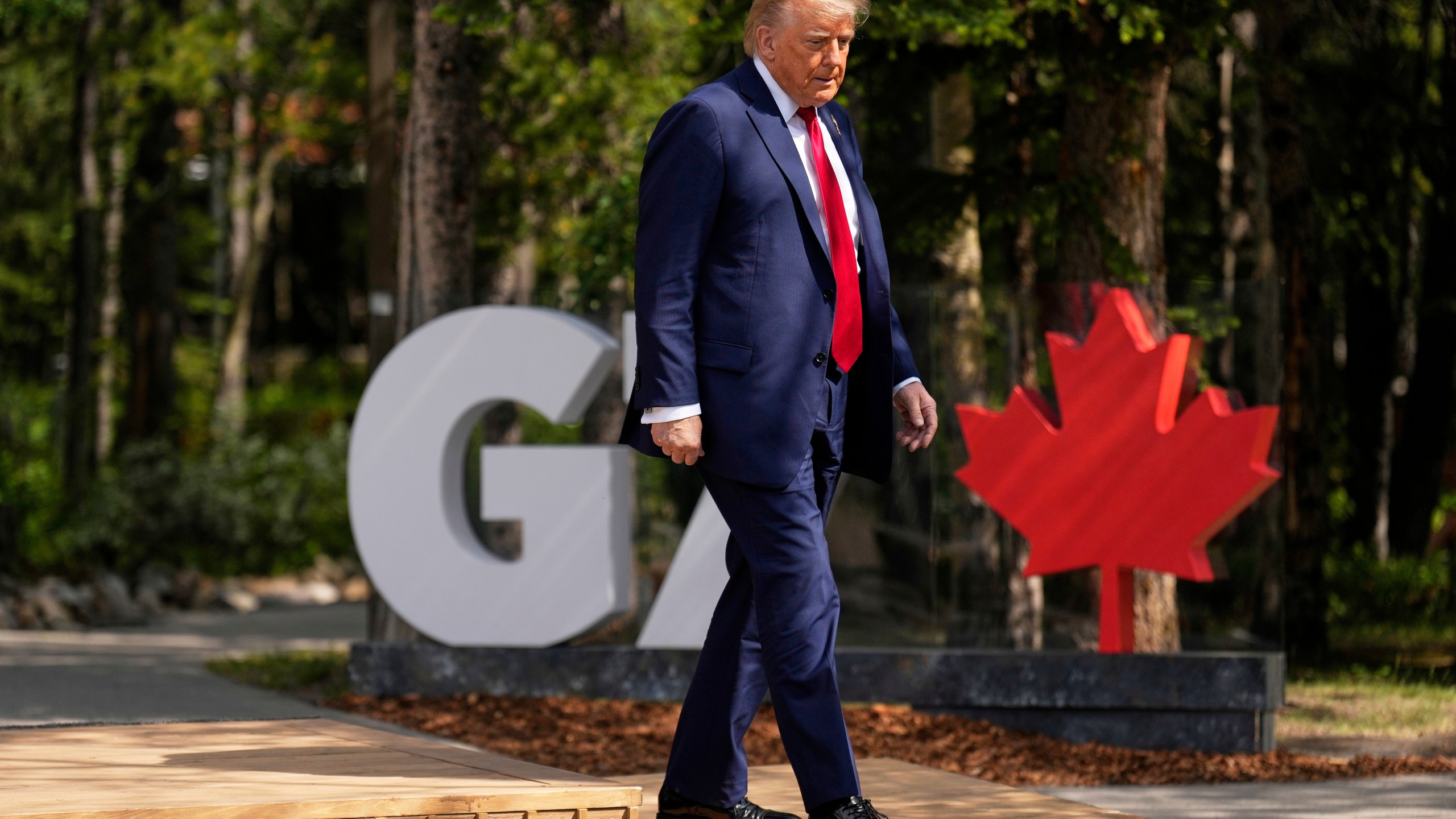 President Donald Trump walks during the official welcome of the G7 Summit, Monday, June 16, 2025, in Kananaskis, Canada. (AP Photo/Mark Schiefelbein)
