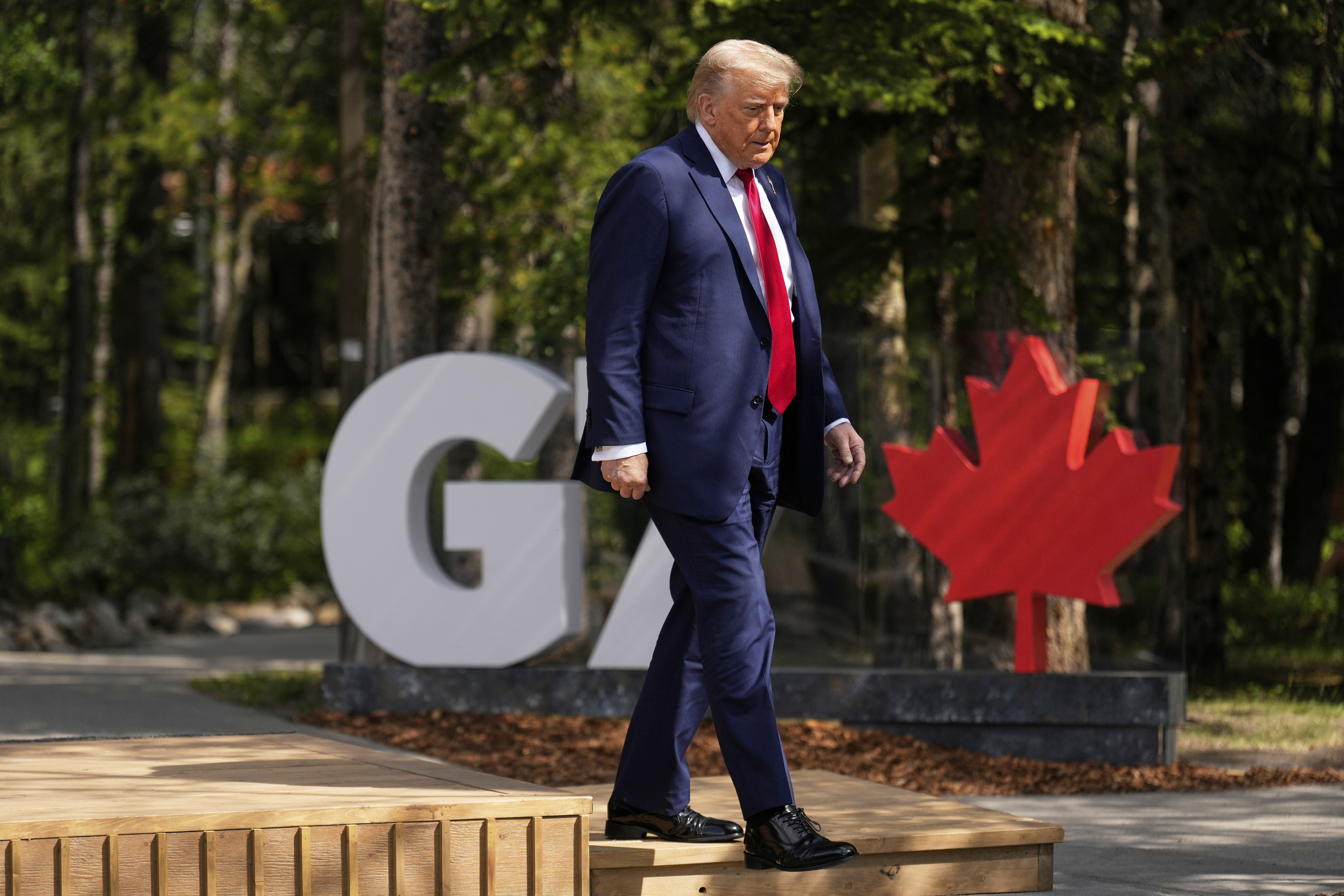 President Donald Trump walks during the official welcome of the G7 Summit, Monday, June 16, 2025, in Kananaskis, Canada. (AP Photo/Mark Schiefelbein)