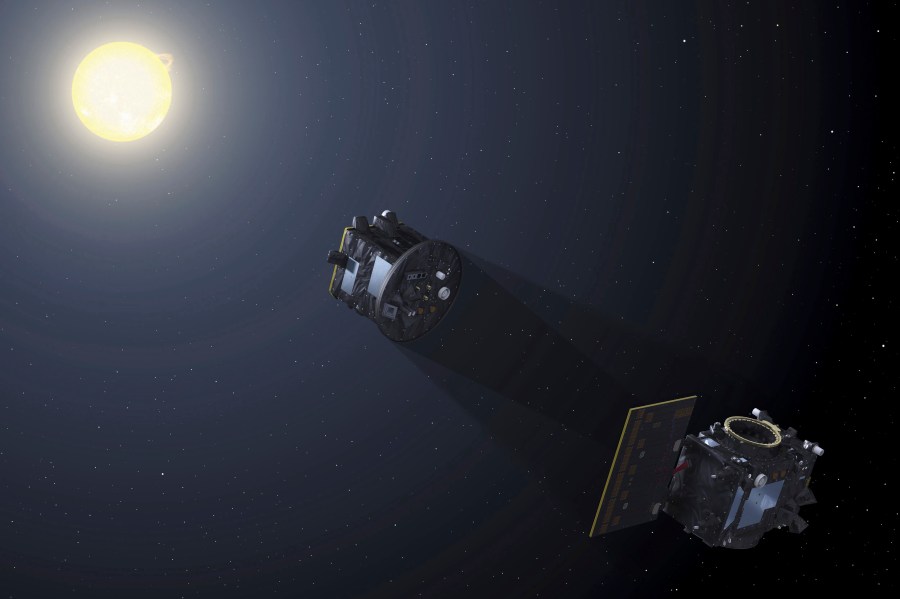 This image provided by the European Space Agency depicts the two spacecraft of the Proba-3 mission aligning to create an eclipse to capture a coronagraph in space. (P. Carril/ESA via AP)