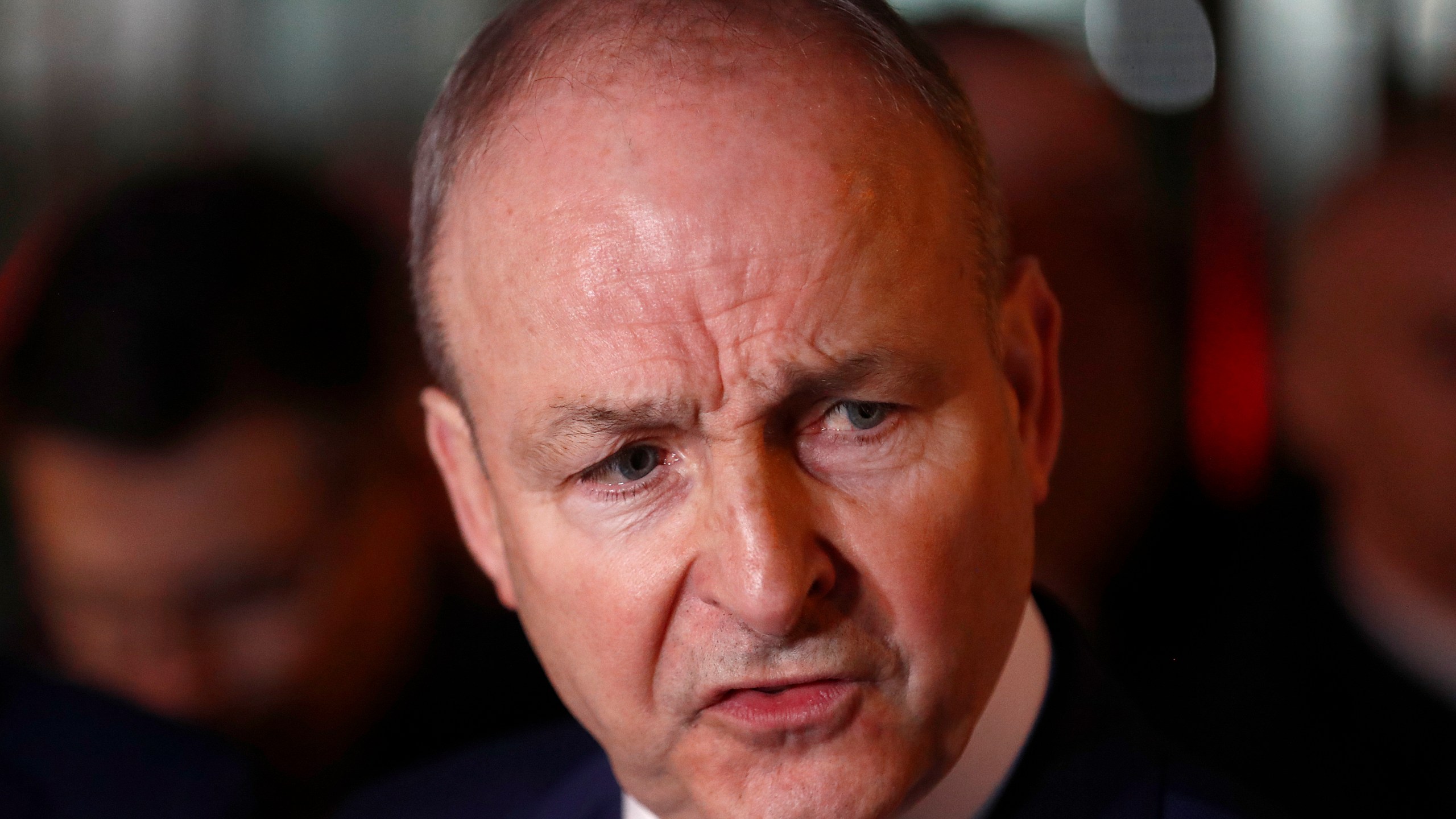 FILE - Fianna Fail leader Micheal Martin talks to the media outside the government building in Dublin, Jan. 22, 2025.(AP Photo/Peter Morrison, File)