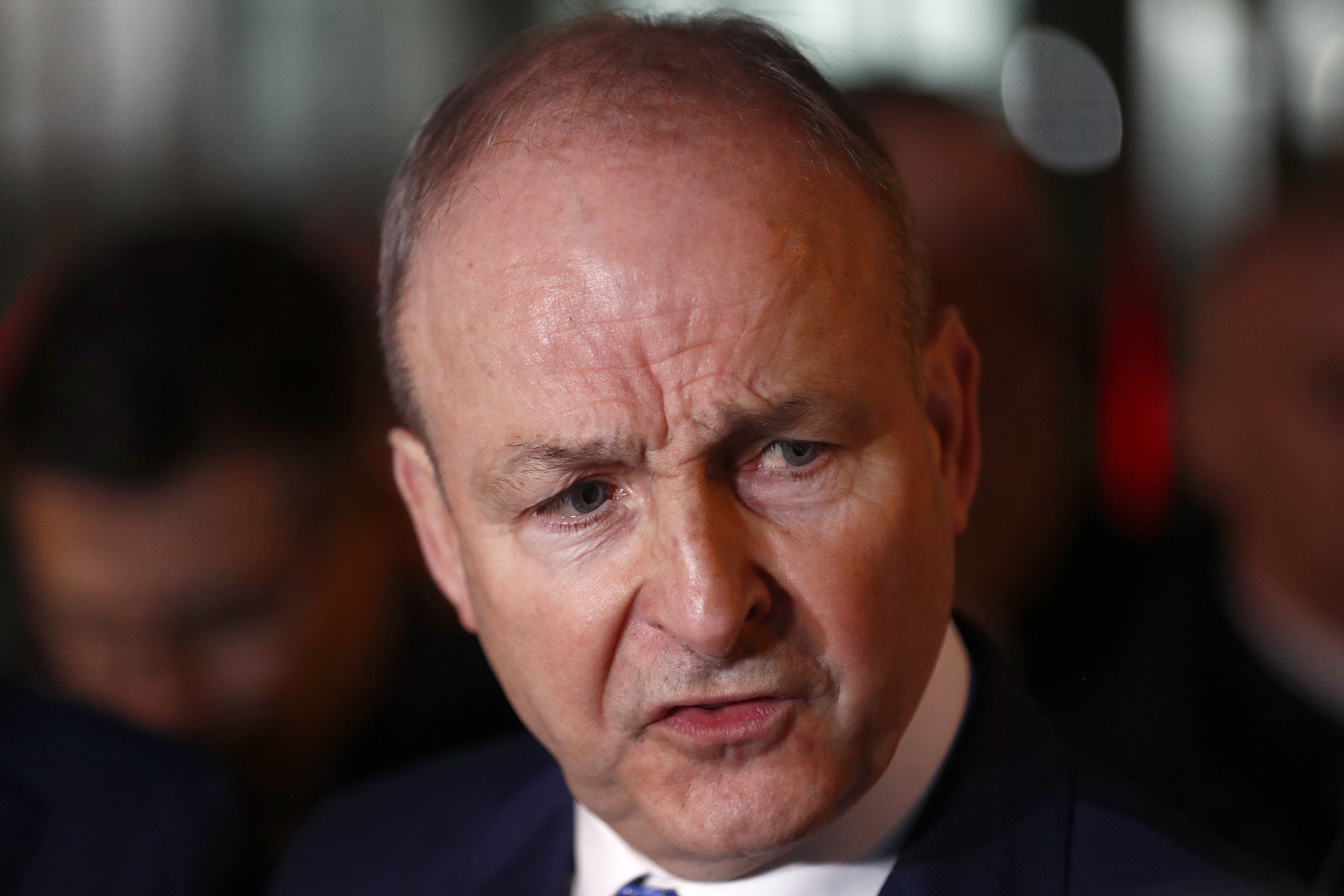 FILE - Fianna Fail leader Micheal Martin talks to the media outside the government building in Dublin, Jan. 22, 2025.(AP Photo/Peter Morrison, File)