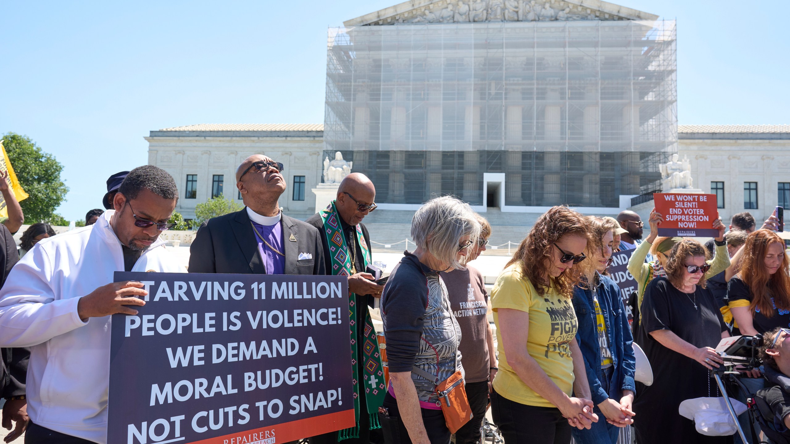 Activists with the Poor People's Campaign protest against spending reductions across Medicaid, food stamps and federal aid in President Donald Trump's spending and tax bill being worked on by Senate Republicans this week, outside the Supreme Court in Washington, Monday, June 2, 2025. (AP Photo/J. Scott Applewhite)