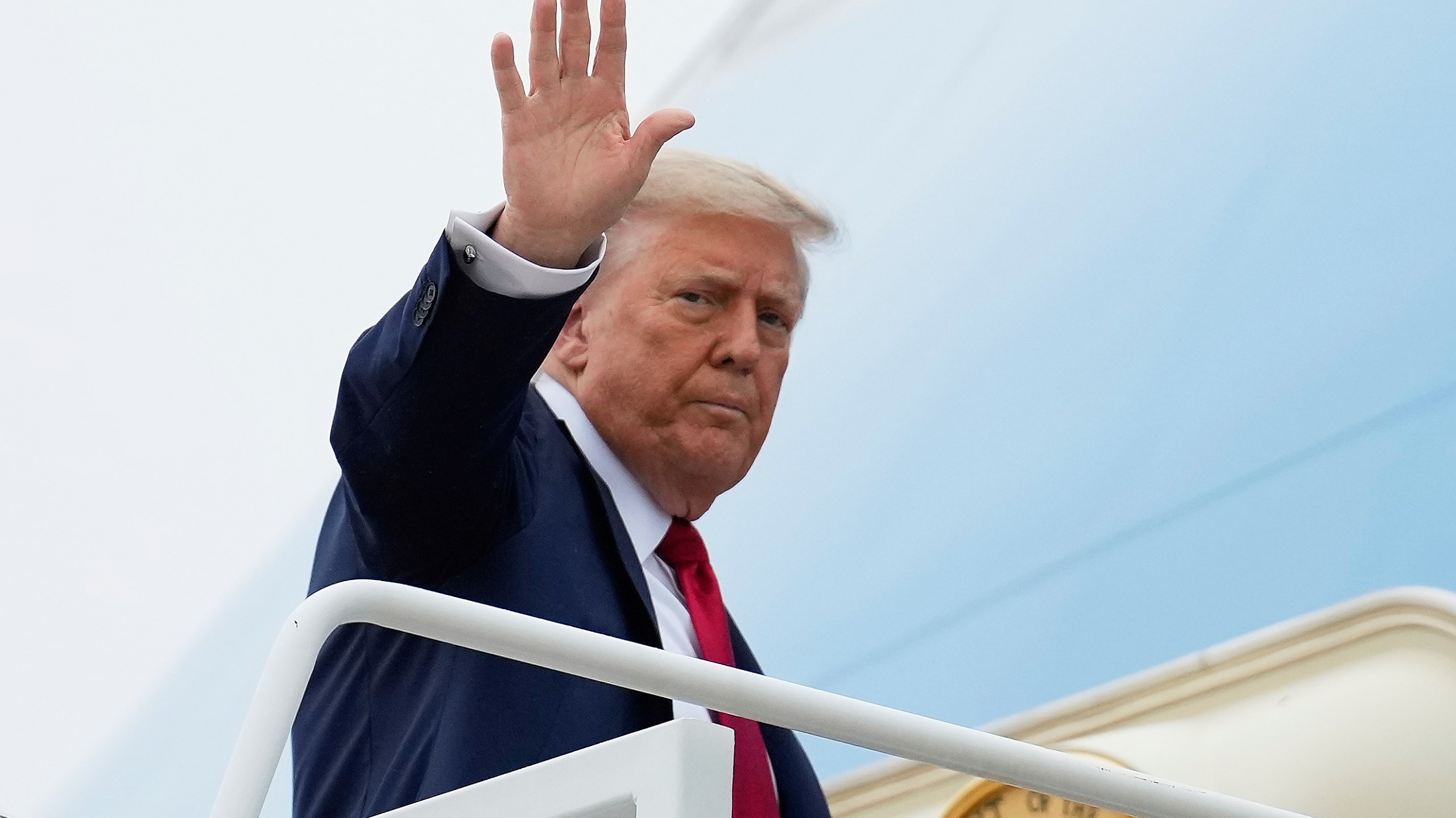 President Donald Trump waves as he boards Air Force One, Sunday, June 15, 2025, at Joint Base Andrews, Md., for a trip to Canada to attend the G7 Summit. (AP Photo/Mark Schiefelbein)