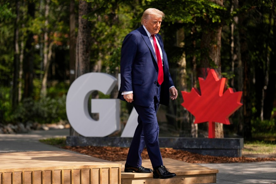President Donald Trump walks during the official welcome of the G7 Summit, Monday, June 16, 2025, in Kananaskis, Canada. (AP Photo/Mark Schiefelbein)