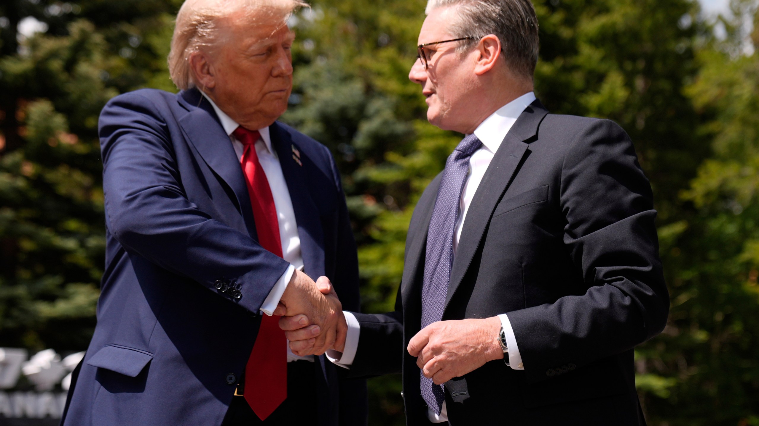 President Donald Trump meets with Britain's Prime Minister Keir Starmer on the sidelines of the G7 Summit, Monday, June 16, 2025, in Kananaskis, Canada. (AP Photo/Mark Schiefelbein)