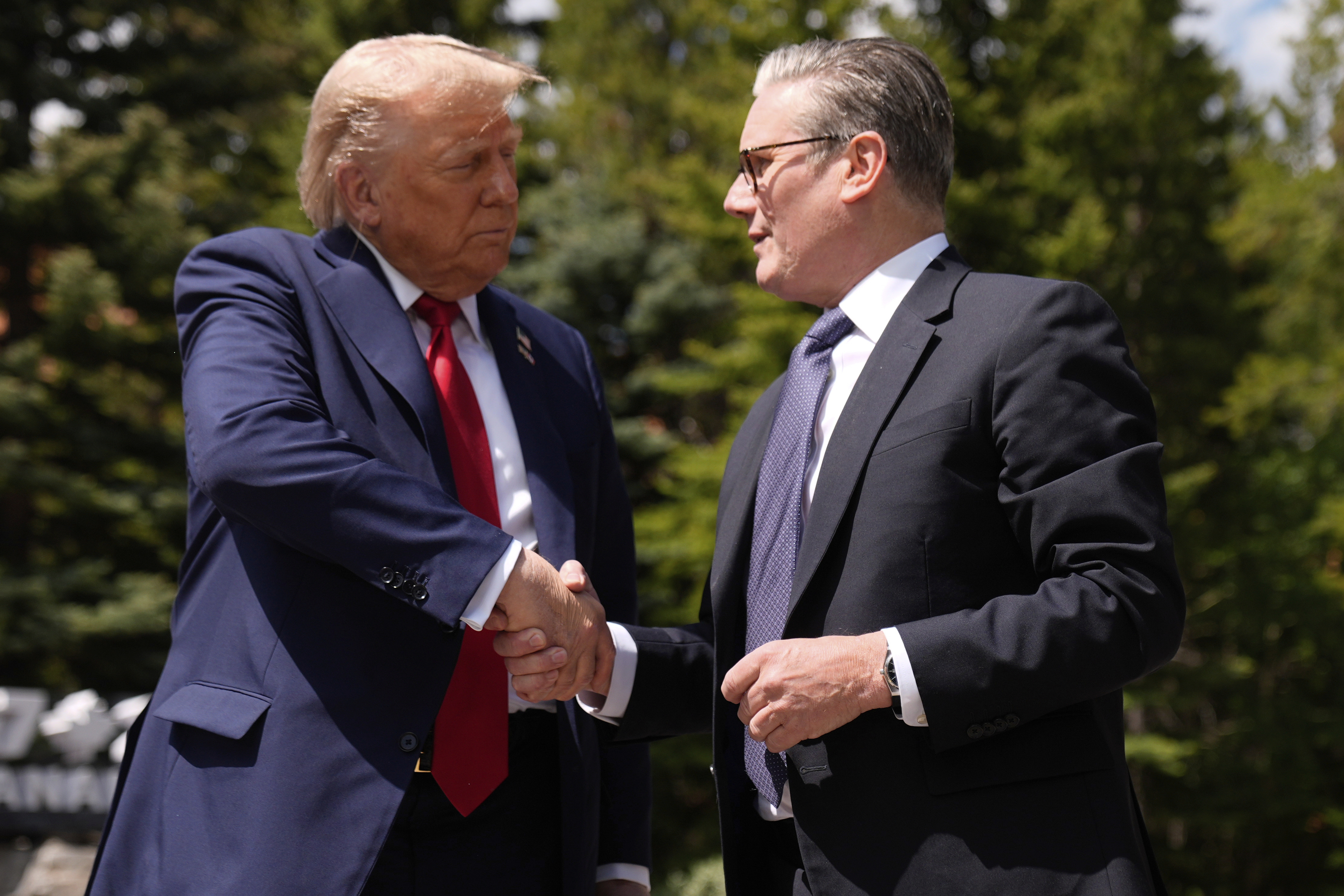 President Donald Trump meets with Britain's Prime Minister Keir Starmer on the sidelines of the G7 Summit, Monday, June 16, 2025, in Kananaskis, Canada. (AP Photo/Mark Schiefelbein)