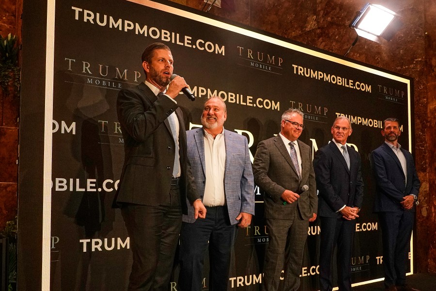 Eric Trump, Don Hendrickson, Eric Thomas, Patrick O'Brien and Donald Trump Jr., left to right, participate in the announcement of Trump Mobile, in New York's Trump Tower, Monday, June 16, 2025. (AP Photo/Richard Drew)