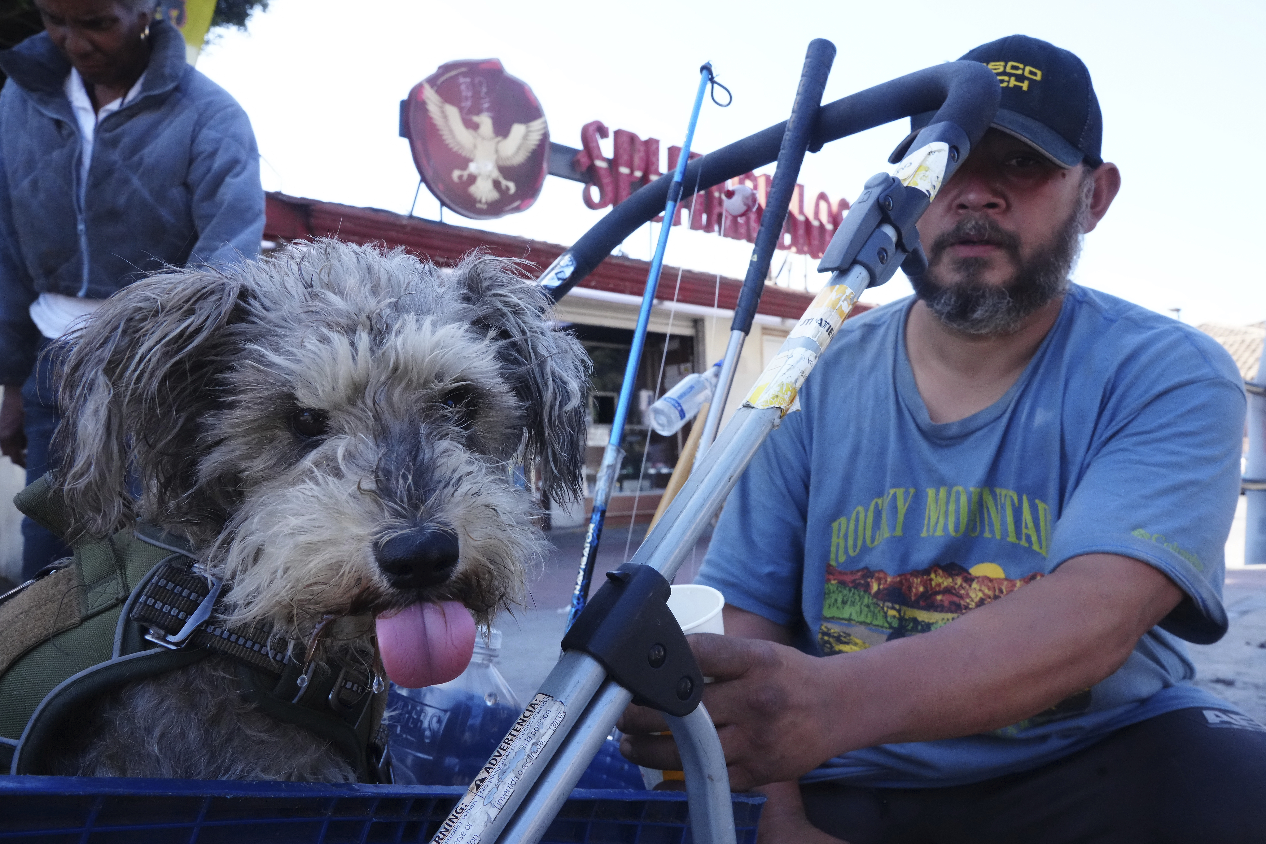 Immigrant Humberto Altamirano, with his dog, Dido, comments on the immigration enforcement in Los Angeles, Monday, June 16, 2025. (AP Photo/Damian Dovarganes)