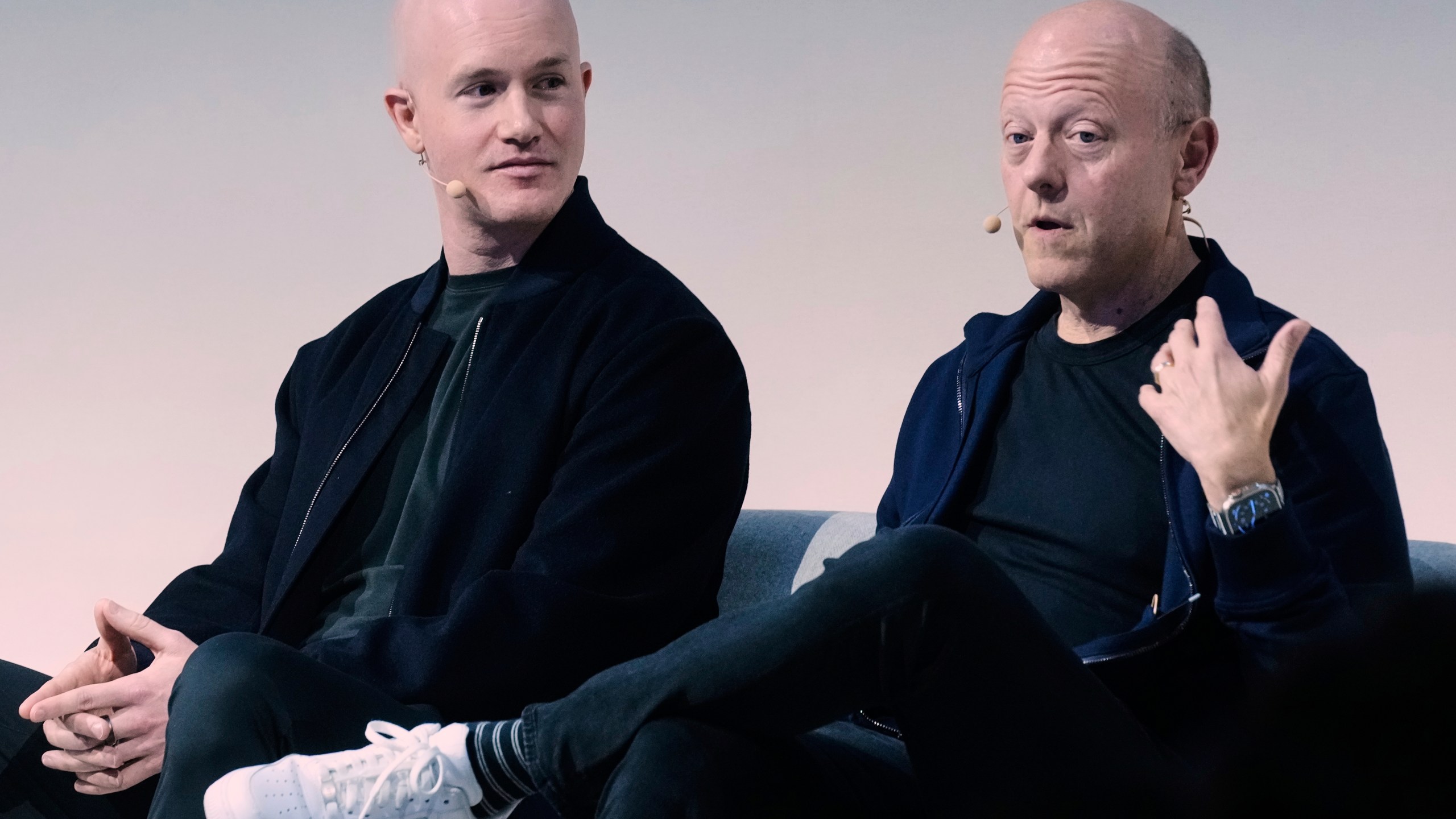 Brian Armstrong, left, Co-founder and CEO of Coinbase, and Jeremy Allaire, Co-Founder, Chairman and CEO of Circle, participate in the State of Crypto Summit, in New York, Thursday, June 12, 2025. (AP Photo/Richard Drew)