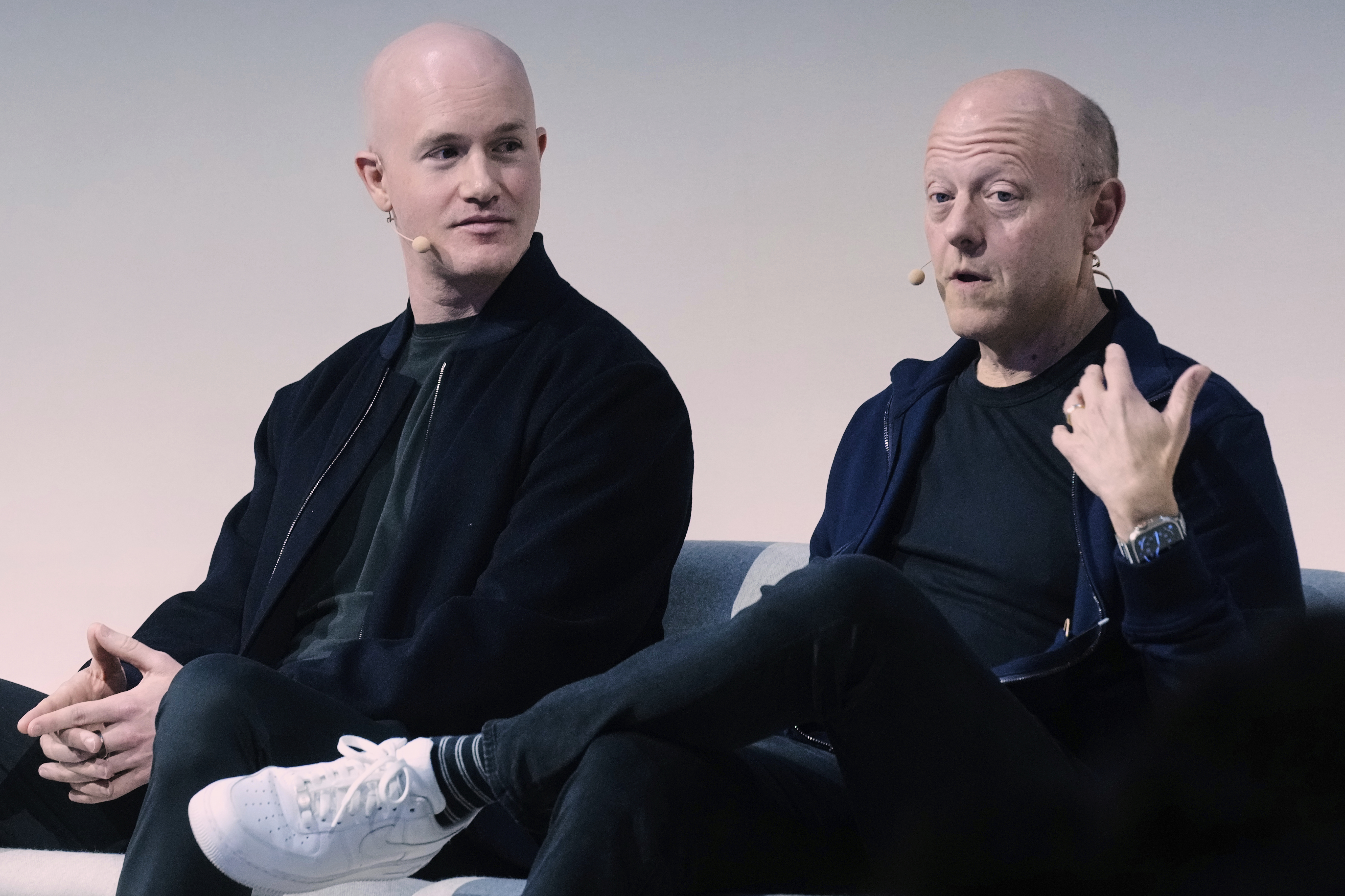 Brian Armstrong, left, Co-founder and CEO of Coinbase, and Jeremy Allaire, Co-Founder, Chairman and CEO of Circle, participate in the State of Crypto Summit, in New York, Thursday, June 12, 2025. (AP Photo/Richard Drew)