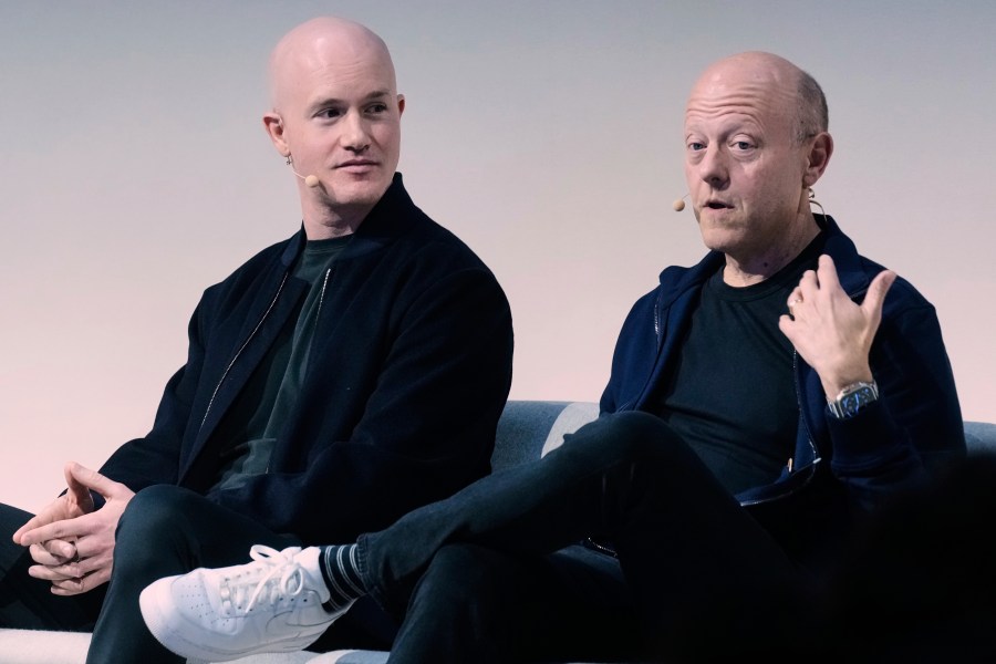 Brian Armstrong, left, Co-founder and CEO of Coinbase, and Jeremy Allaire, Co-Founder, Chairman and CEO of Circle, participate in the State of Crypto Summit, in New York, Thursday, June 12, 2025. (AP Photo/Richard Drew)