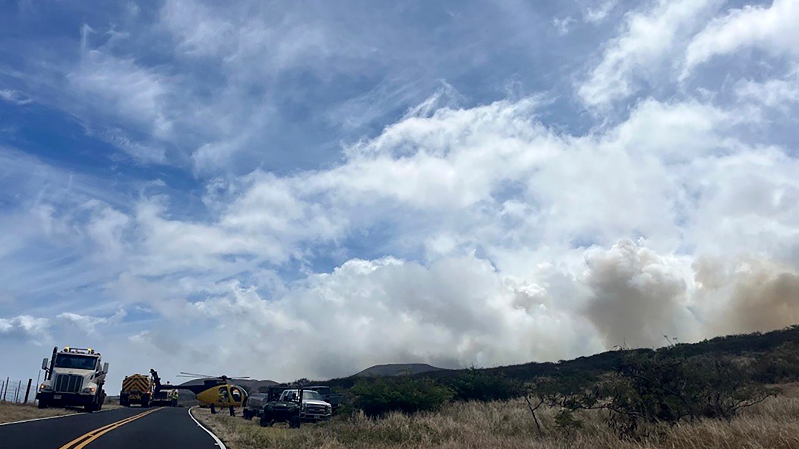 This photo provided by the Maui Fire Department shows smoke from a fire burning in Kahikinui, Hawaii on the island of Maui on Sunday, June 15, 2025. (Maui Fire Department via AP)