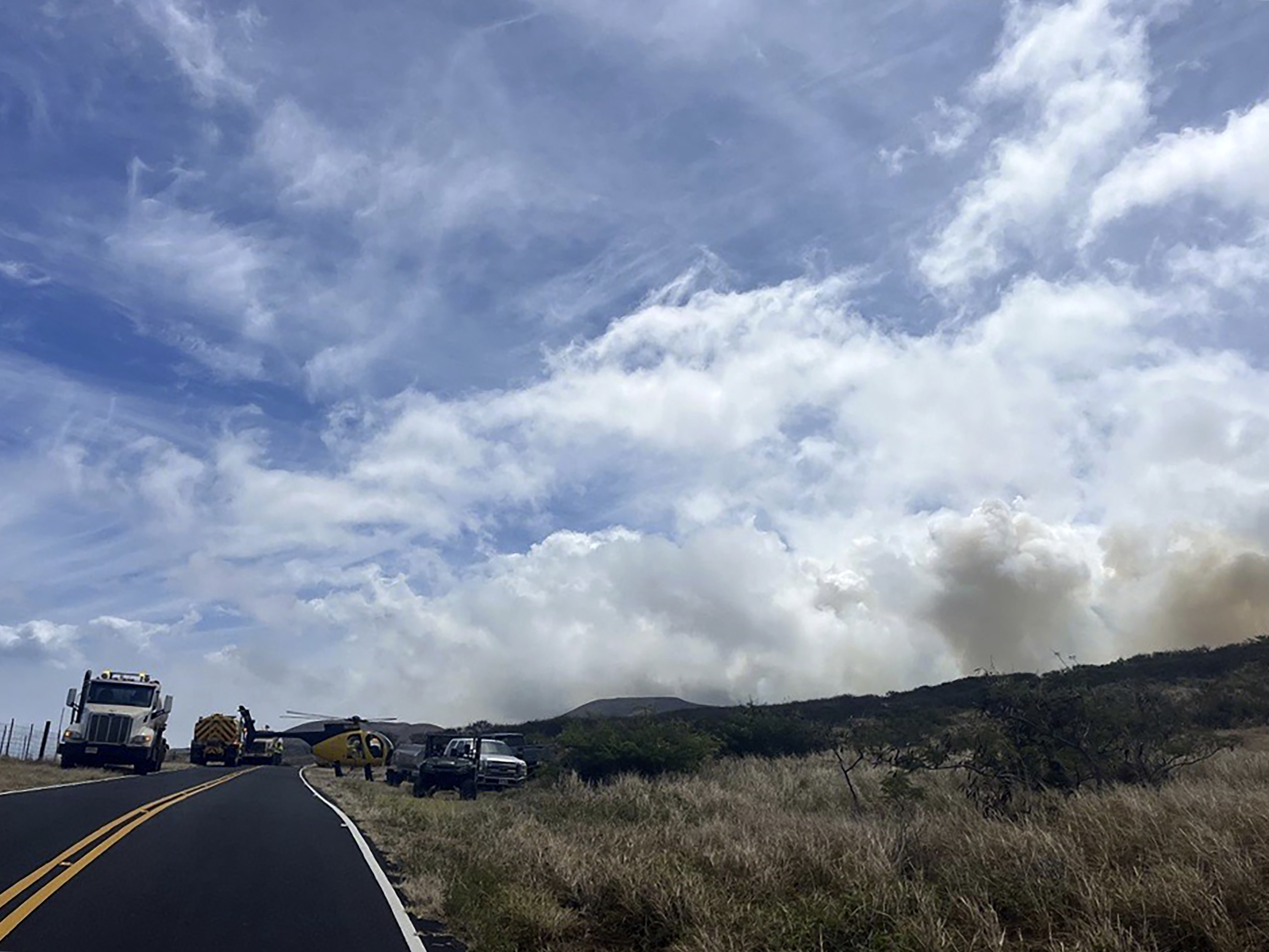 This photo provided by the Maui Fire Department shows smoke from a fire burning in Kahikinui, Hawaii on the island of Maui on Sunday, June 15, 2025. (Maui Fire Department via AP)
