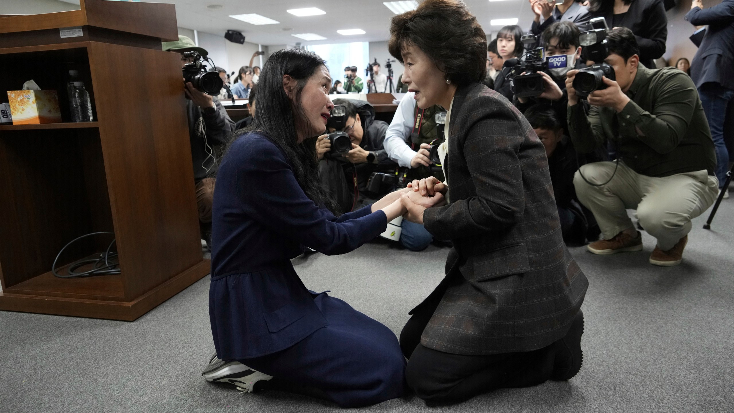 FILE - Truth and Reconciliation Commission Chairperson Park Sun Young, right, comforts adoptee Yooree Kim during a press conference in Seoul, South Korea, March 26, 2025. (AP Photo/Ahn Young-joon, File)