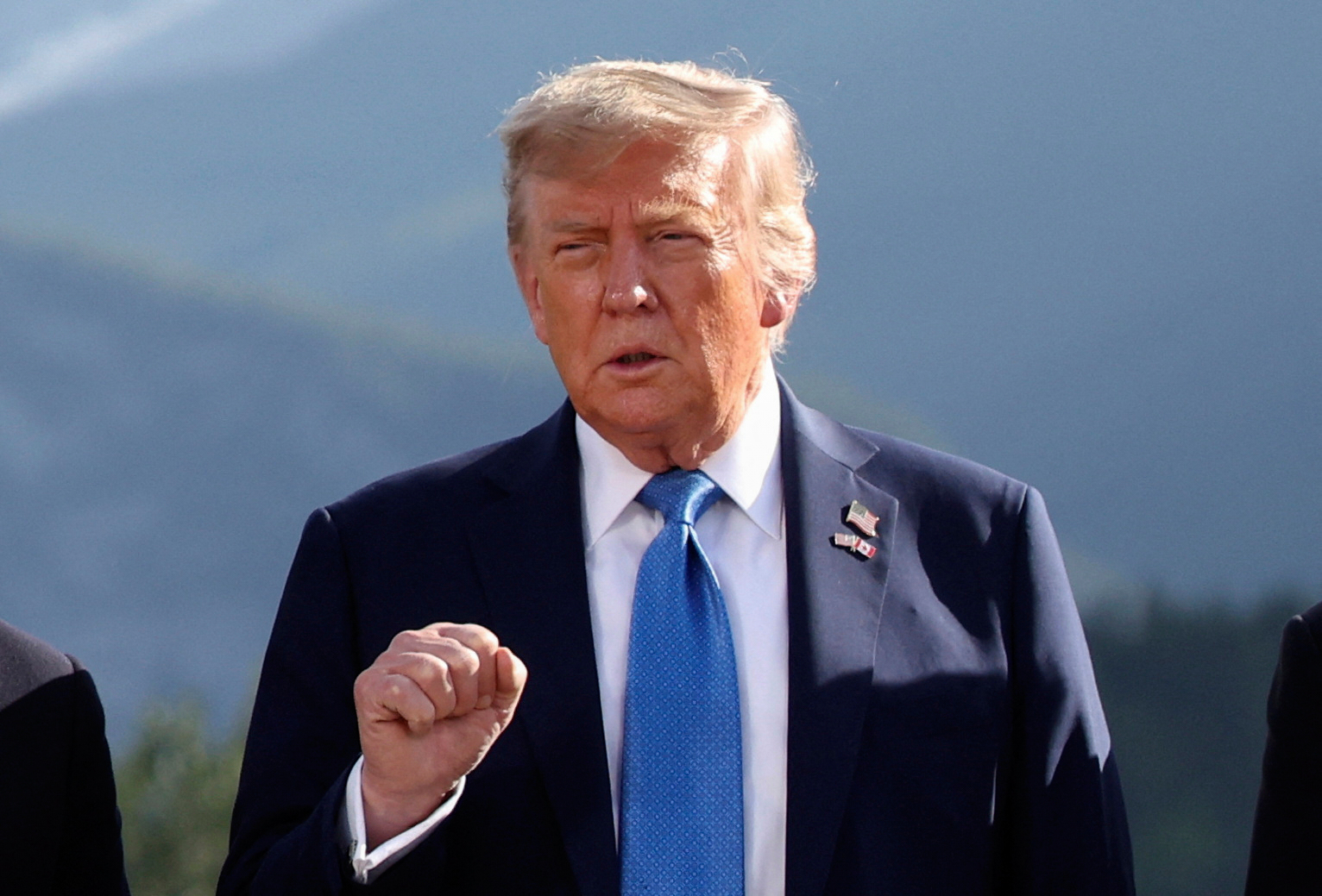 U.S. President Donald Trump gestures as he attends a family photo session during the G7 Summit, in Kananaskis, Alberta, Monday, June 16, 2025. (Suzanne Plunkett/Pool Photo via AP)