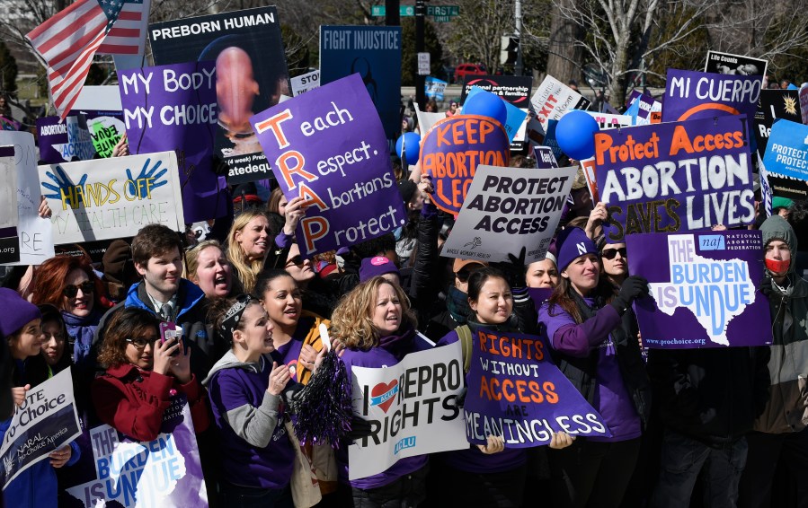 FILE - Pro-abortion rights protesters rally outside the Supreme Court in Washington, Wednesday, March 2, 2016. (AP Photo/Susan Walsh, File)