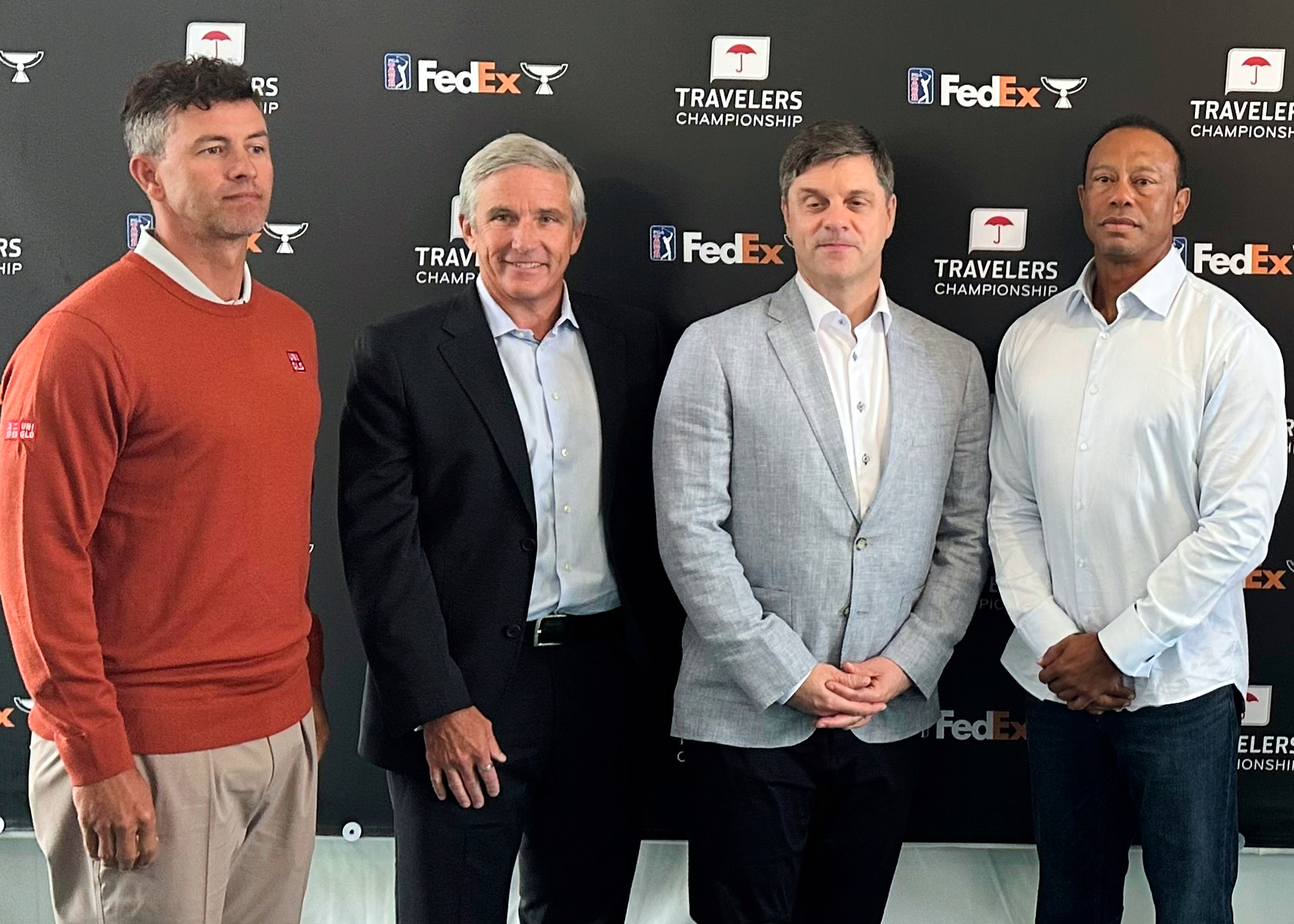 From left, Adam Scott, PGA Tour Commissioner Jay Monahan, incoming CEO Brian Rolapp, Tiger Woods at the Travelers Championship in Cromwell, Connecticut, Tuesday, June 17, 2025. (AP Photo/Doug Ferguson).