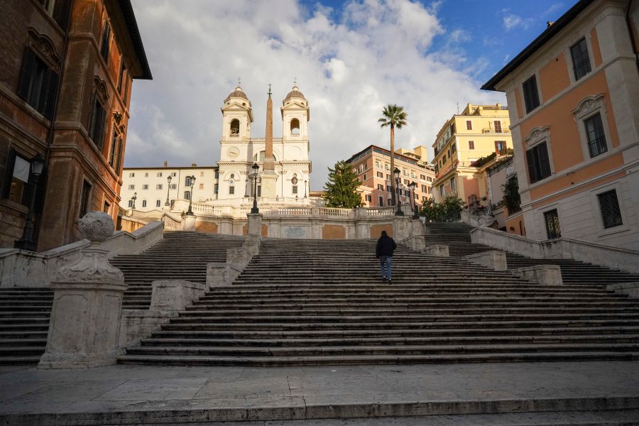FILE - A man walks up the historical Spanish Steps, in Rome, Friday, Nov. 20, 2020. (AP Photo/Andrew Medichini, file)