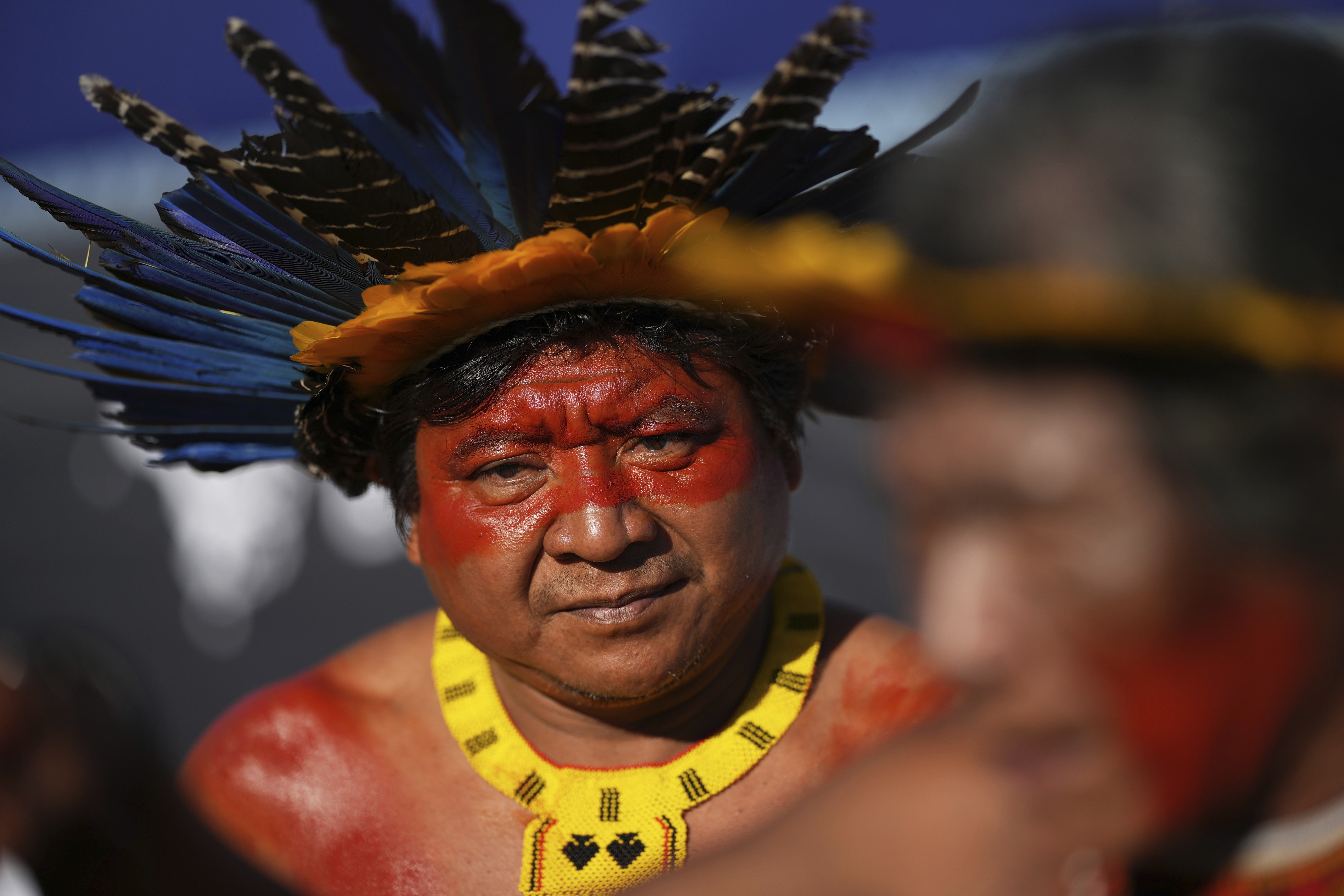 An Indigenous man protests against the auction of dozens of oil blocks, including blocks near the mouth of the Amazon River, in Rio de Janeiro, Tuesday, June 17, 2025. (AP Photo/Silvia Izquierdo