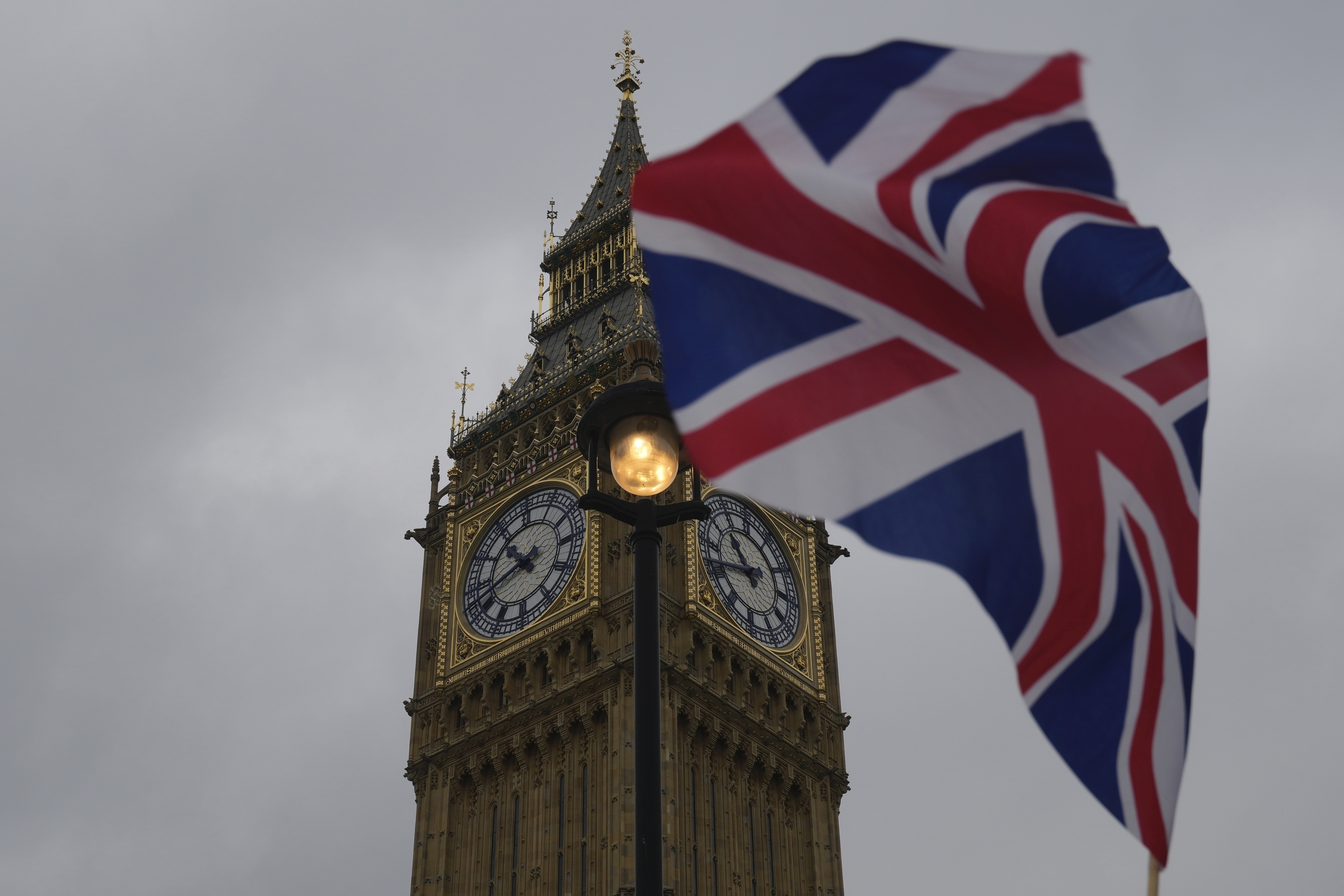 FILE - A Union flag is displayed outside the Houses of Parliament, in London, Thursday, May 23, 2024.(AP Photo/Kin Cheung, File)