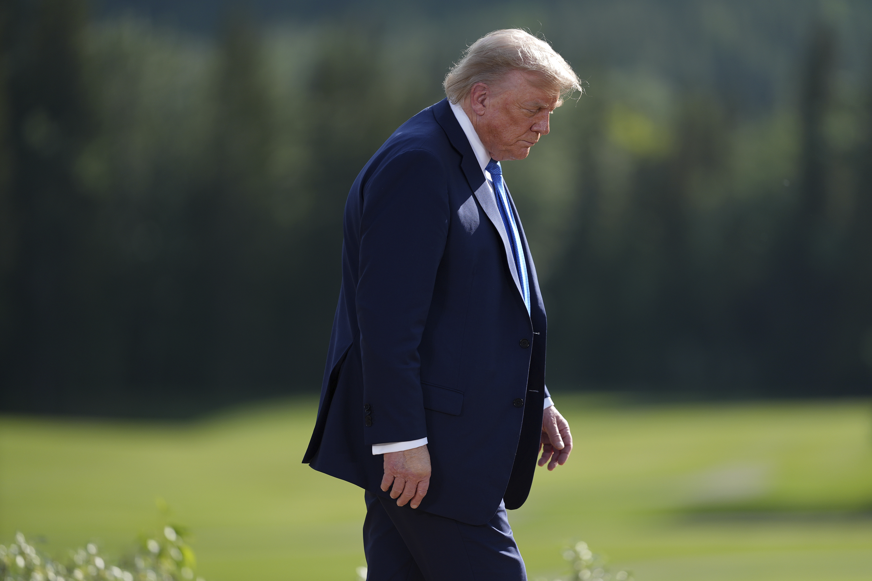 President Donald Trump walks away following the family photograph during the G7 Summit in Kananaskis, Alberta, Monday, June 16, 2025. (Darryl Dyck/The Canadian Press via AP)