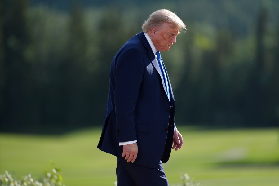 President Donald Trump walks away following the family photograph during the G7 Summit in Kananaskis, Alberta, Monday, June 16, 2025. (Darryl Dyck/The Canadian Press via AP)