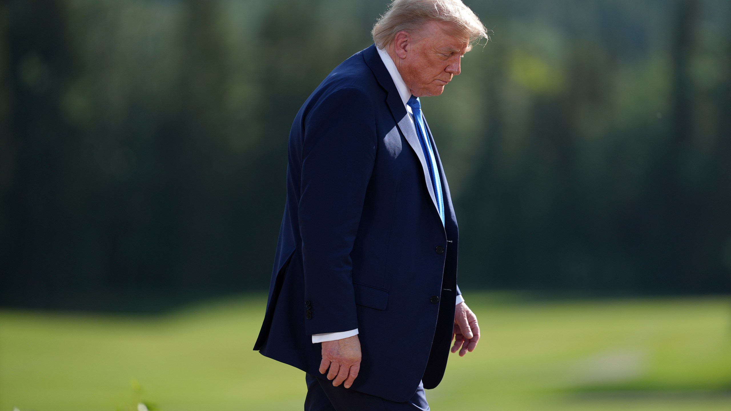 President Donald Trump walks away following the family photograph during the G7 Summit in Kananaskis, Alberta, Monday, June 16, 2025. (Darryl Dyck/The Canadian Press via AP)