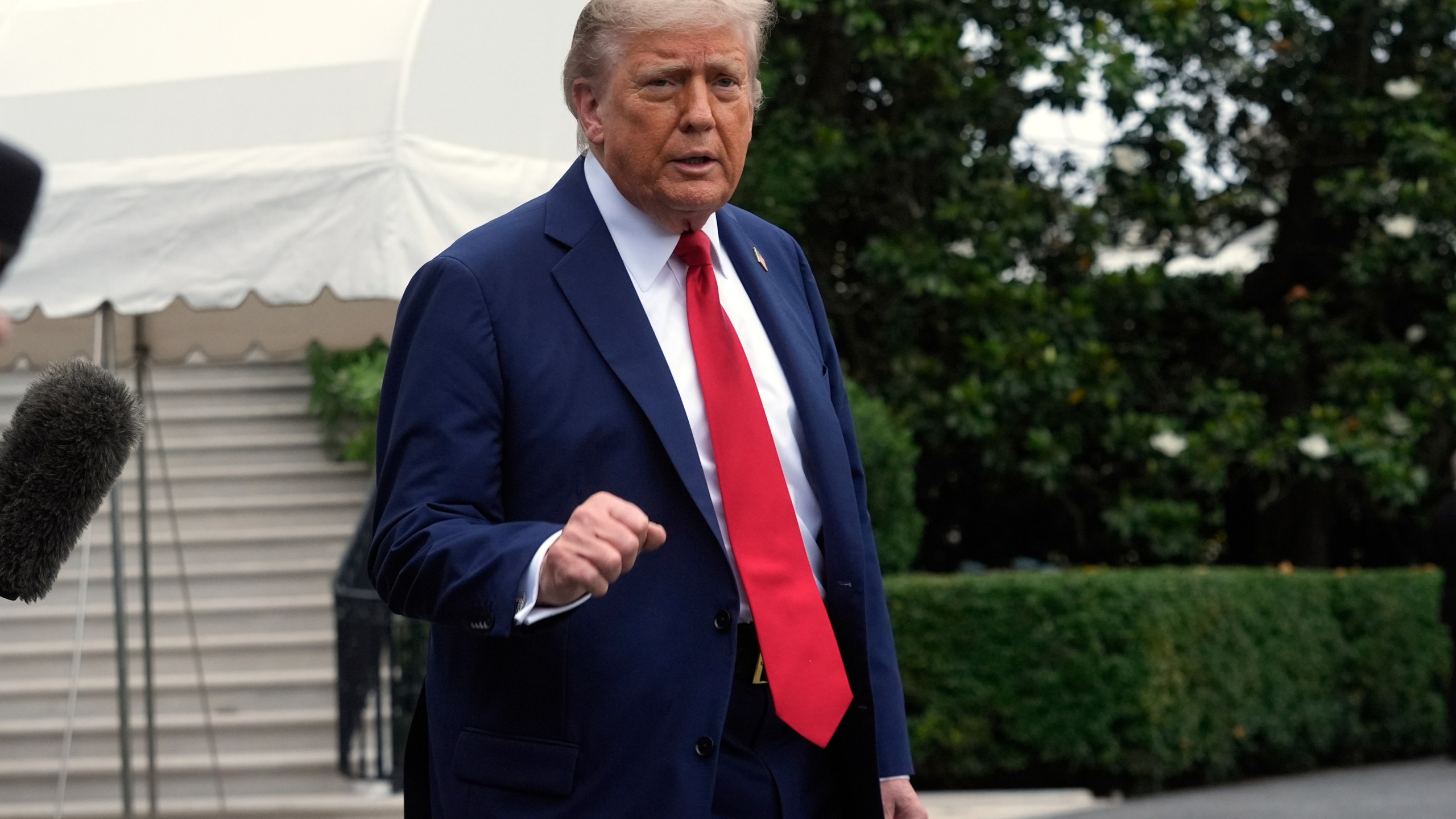 President Donald Trump walks to board Marine One after speakiing with reporters to depart the White House on his way to attend the G7 Summit in Canada, Sunday, June 15, 2025, in Washington. (AP Photo/Manuel Balce Ceneta)