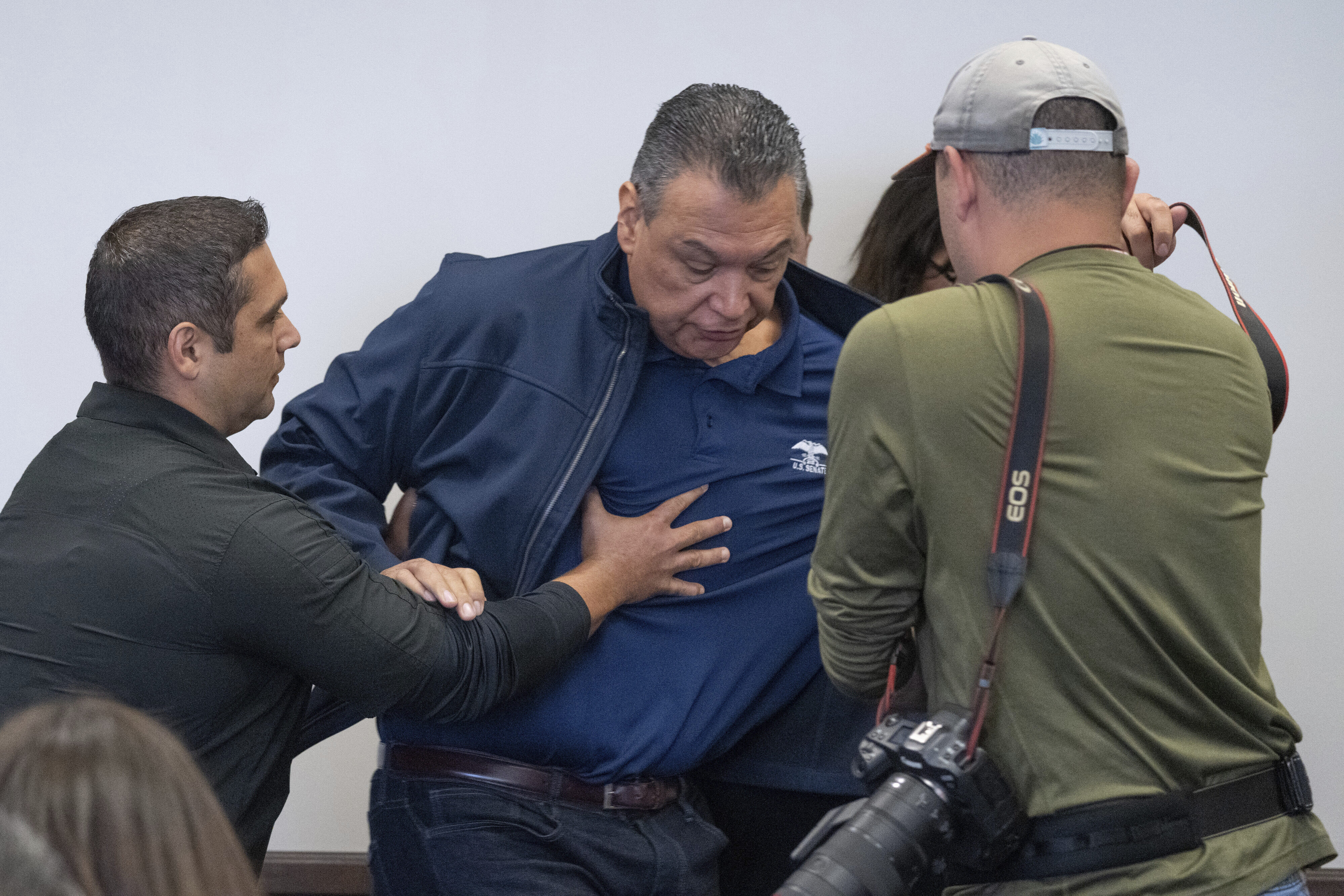 U.S. Sen. Alex Padilla, D-Calif., is pushed out of the room as Homeland Security Secretary Kristi Noem holds a news conference regarding the recent protests in Los Angeles, Thursday, June 12, 2025. (David Crane/The Orange County Register via AP)