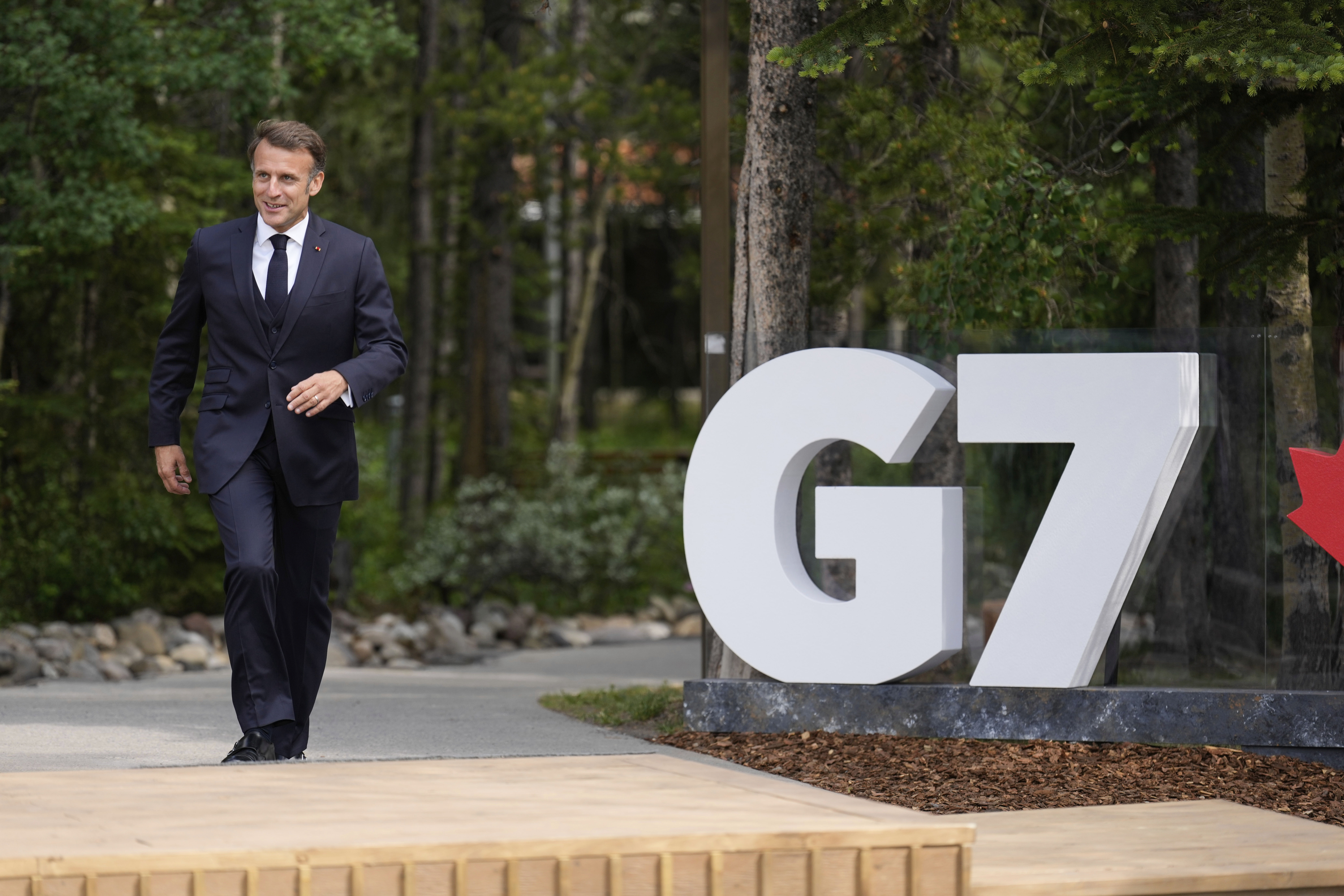 France's President Emmanuel Macron arrives during the official welcome of the G7 Summit, Monday, June 16, 2025, in Kananaskis, Canada. (AP Photo/Mark Schiefelbein)