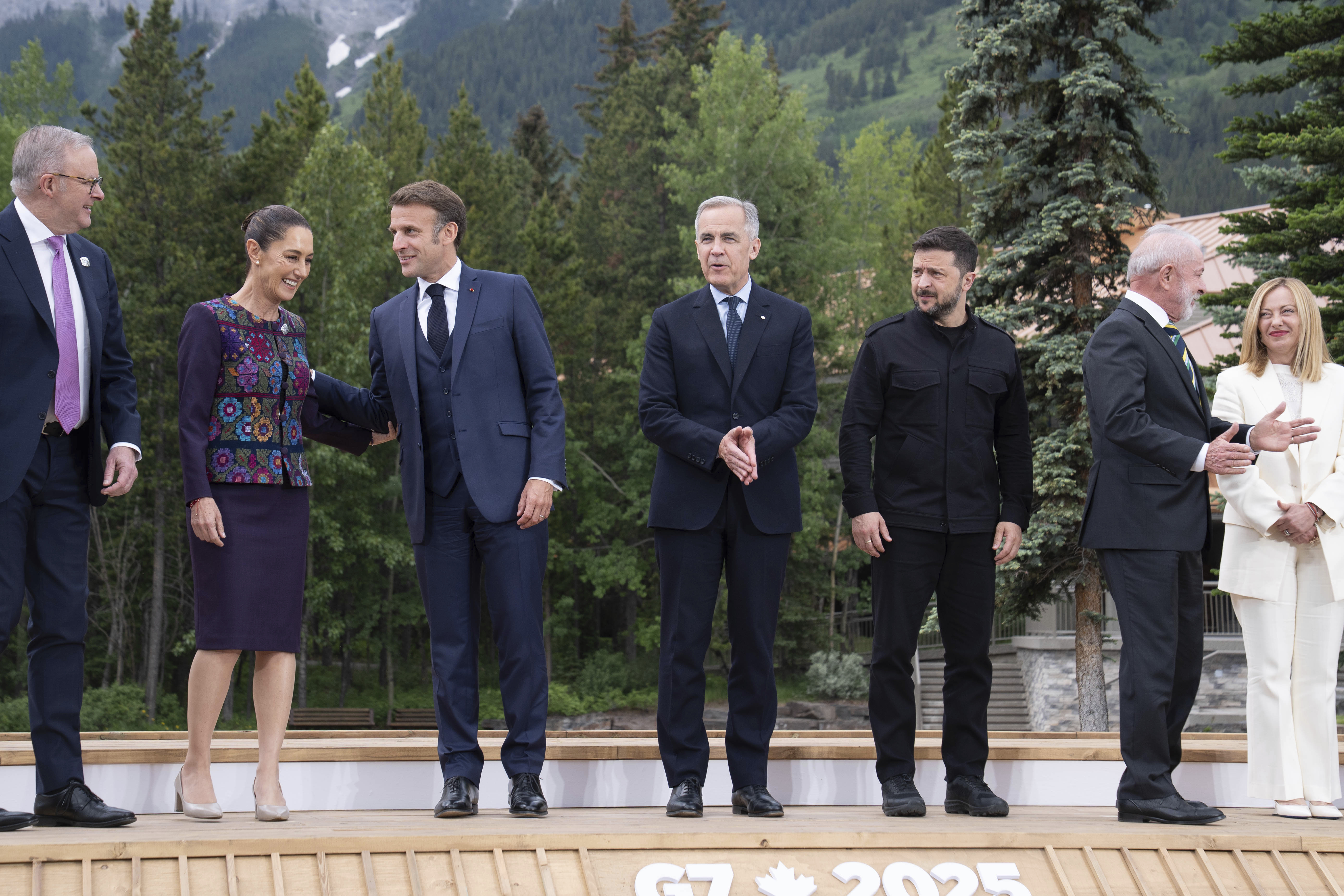 Australia's Prime Minister Anthony Albanese, from left, President of Mexico Claudia Sheinbaum, President of France Emmanuel Macron, Canada's Prime Minister Mark Carney, President of Ukraine Volodymyr Zelenskyy, President of Brazil Luiz Inacio Lula da Silva and Italy's Prime Minister Giorgia Meloni during a family photo at the G7 leaders' summit in Kananaskis, Alberta, Tuesday, June 17, 2025. (Stefan Rousseau/Pool Photo via AP)