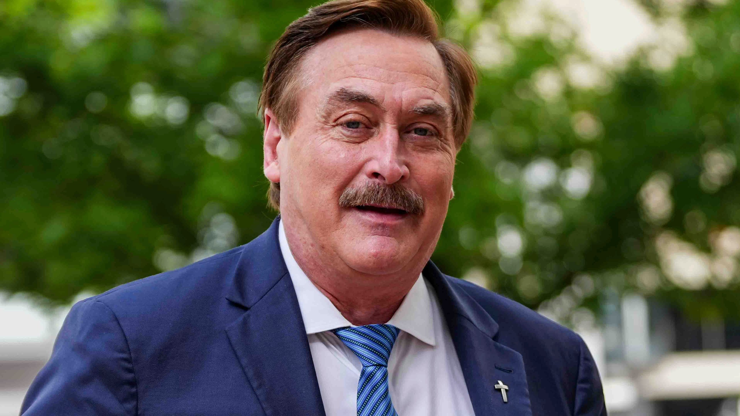 Mike Lindell walks into federal district court for a defamation trial on Thursday, June 5, 2025, in Denver. (AP Photo/Jack Dempsey)