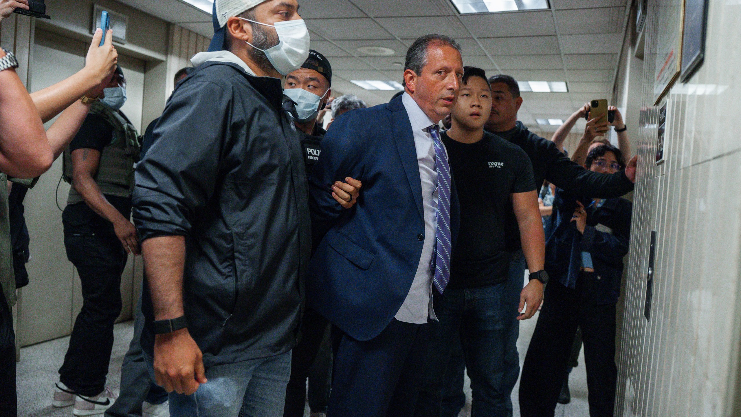 New York City Comptroller Brad Lander is placed under arrest by Immigration and Customs Enforcement (ICE) and FBI agents outside federal immigration court on Tuesday, June 17, 2025, in New York. (AP Photo/Olga Fedorova)