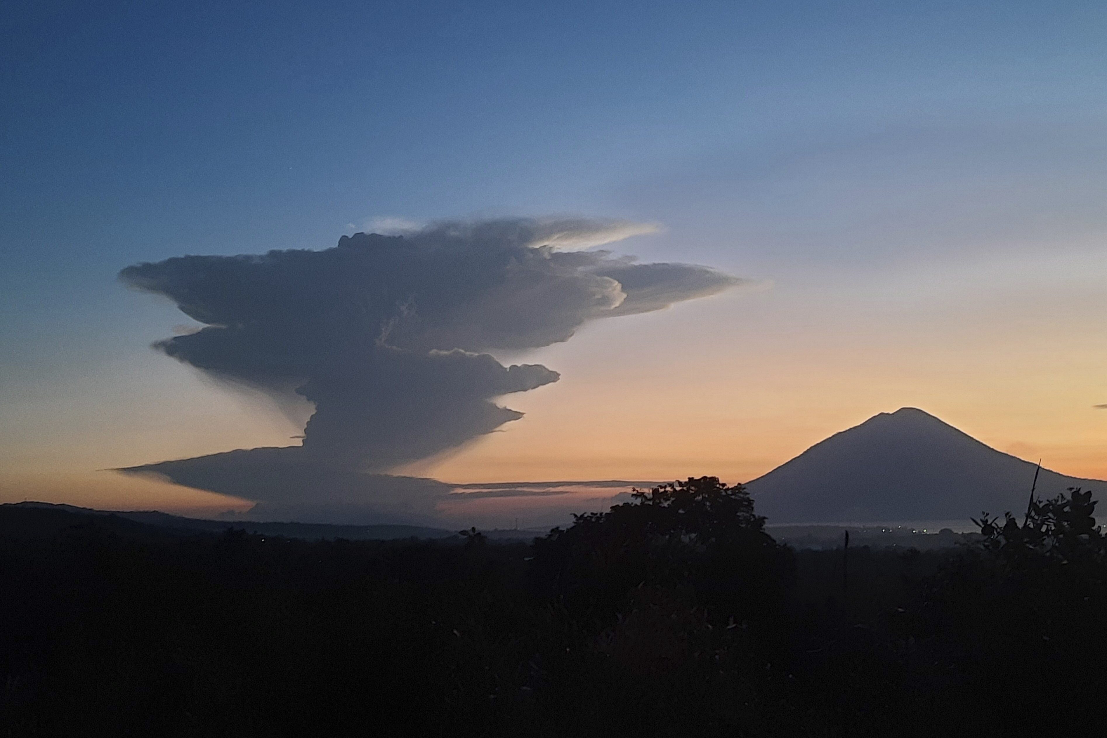 Volcanic smoke billows from Mount Lewotobi Laki-Laki during an eruption, as seen from Lembata, Indonesia, Tuesday, June 17, 2025. (AP Photo/Andre Kriting)