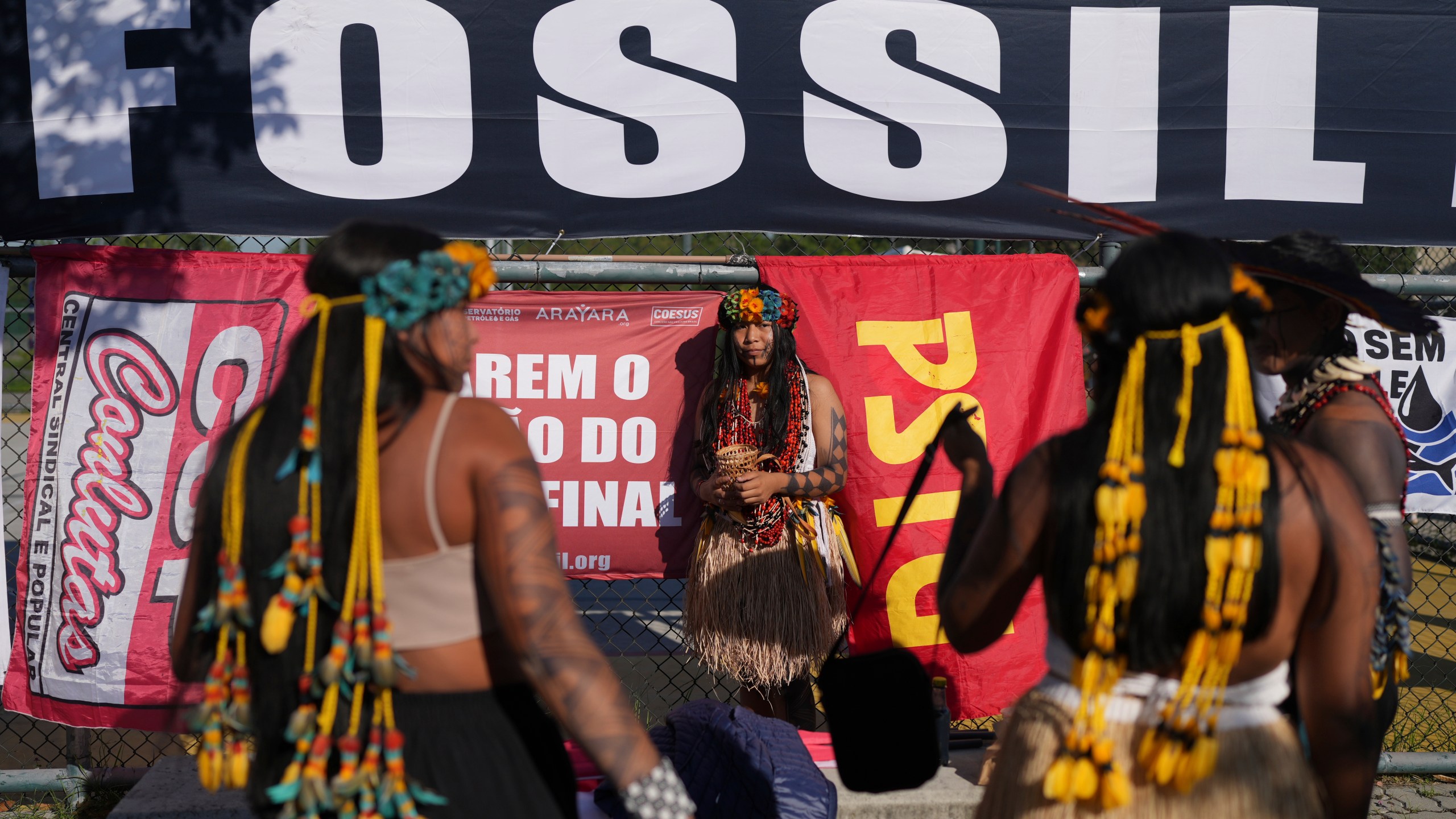 Indigenous women attend a protest against the auction of dozens of oil blocks, including blocks near the mouth of the Amazon River, in Rio de Janeiro, Tuesday, June 17, 2025. (AP Photo/Silvia Izquierdo