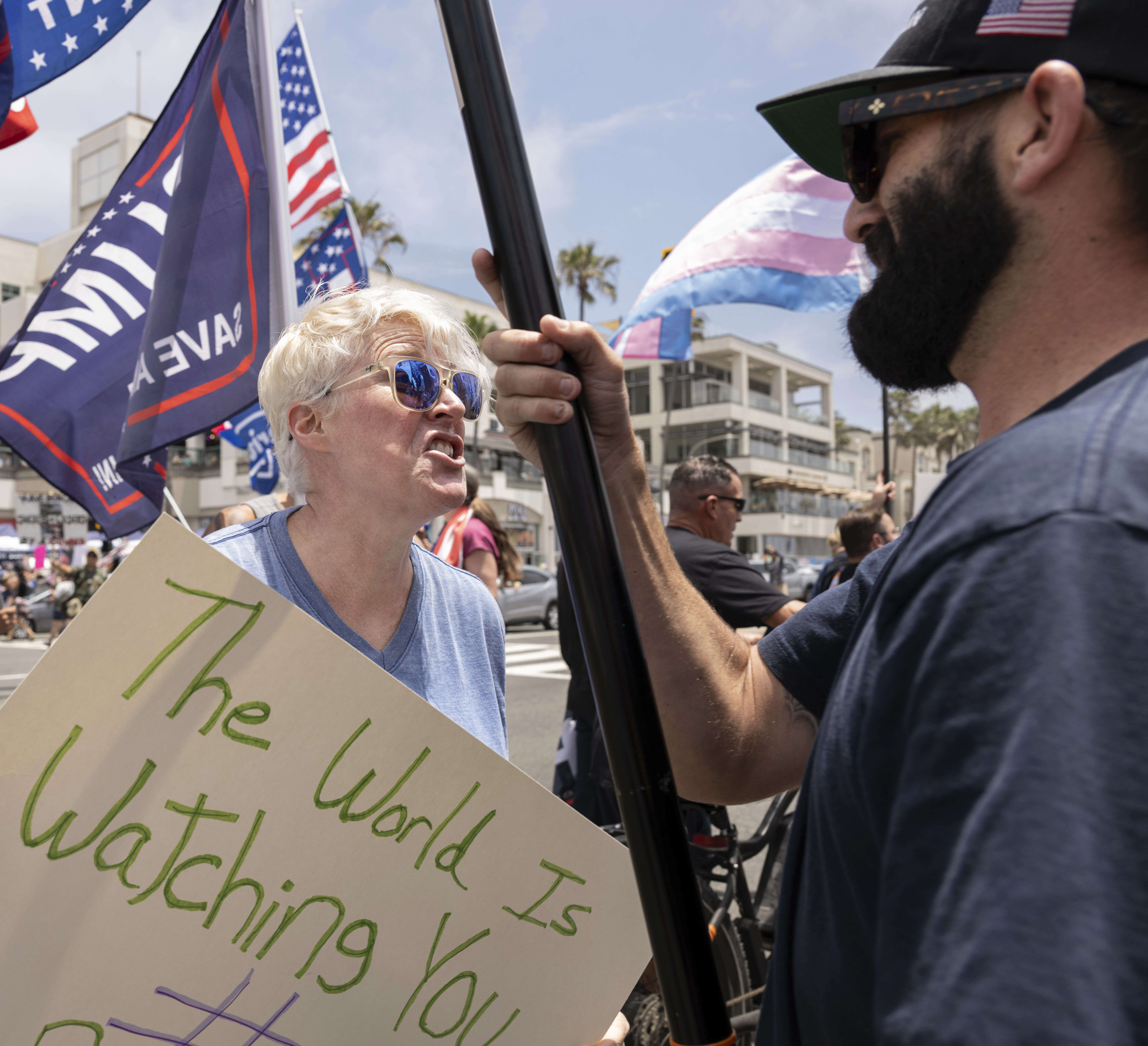 Michelle Kasper of Fountain Valley, argues with a Trump supporter who said his name is Donald J. Trump during the No Kings protest in Huntington Beach, Calif., on Saturday, June 14, 2025. (Mindy Schauer/The Orange County Register via AP)