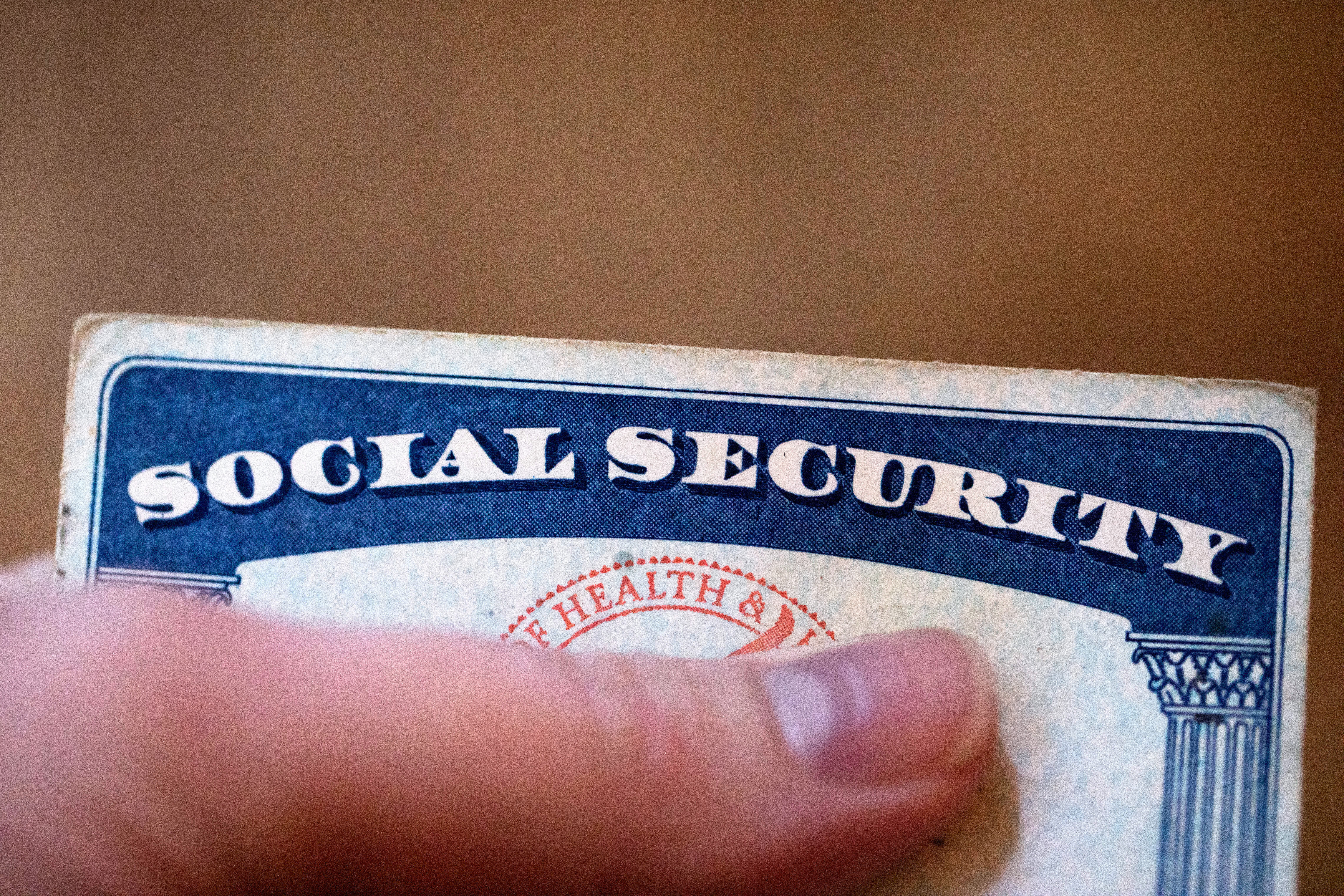 FILE - A Social Security card is displayed on Oct. 12, 2021, in Tigard, Ore. The go-broke dates for Medicare and Social Security’s trust funds have moved up as rising health care costs and new legislation affecting Social Security benefits have contributed to closer projected depletion dates. That's according to an annual report released Wednesday. (AP Photo/Jenny Kane, File)
