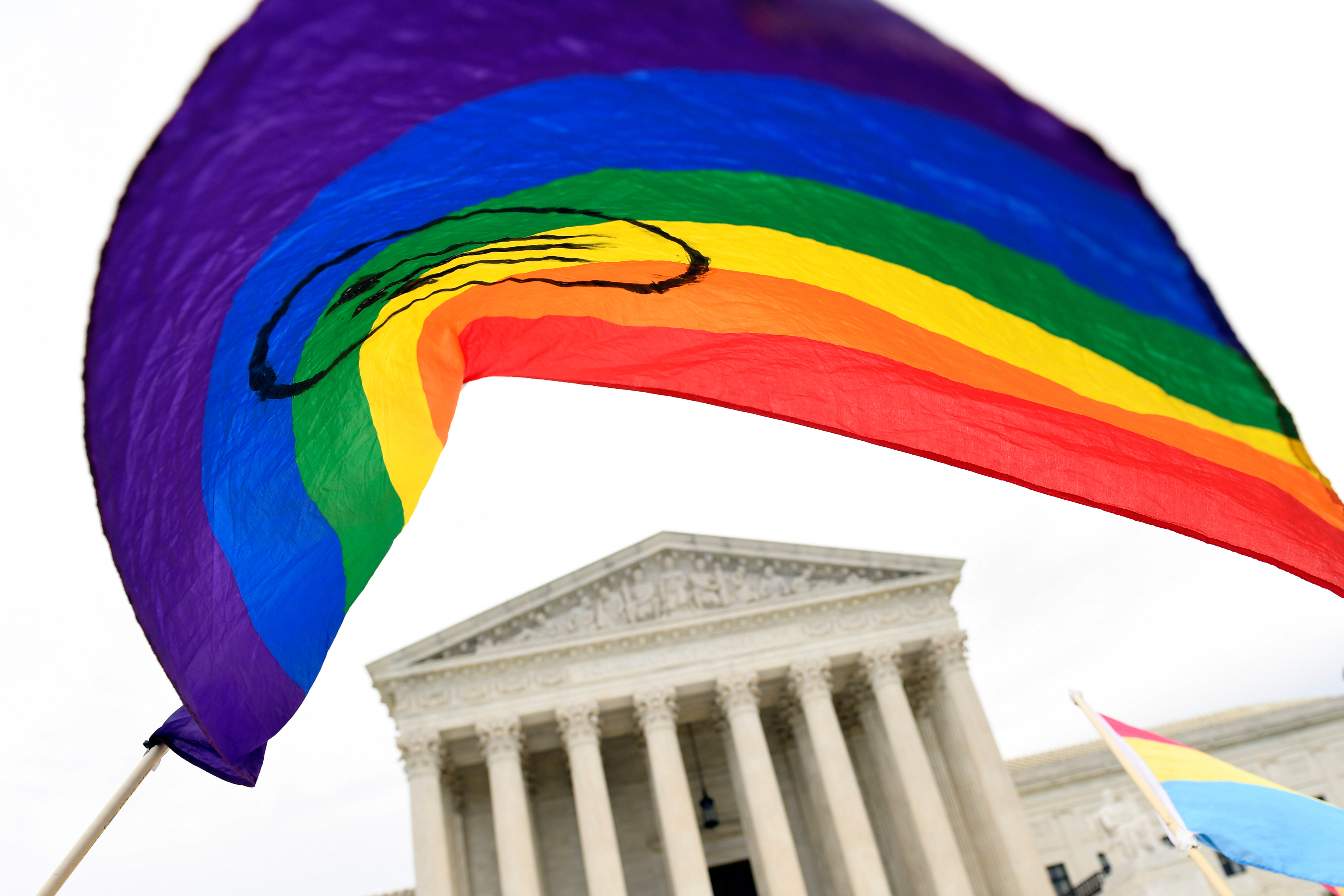 FILE - People gather outside the Supreme Court in Washington, Oct. 8, 2019. (AP Photo/Susan Walsh, File)