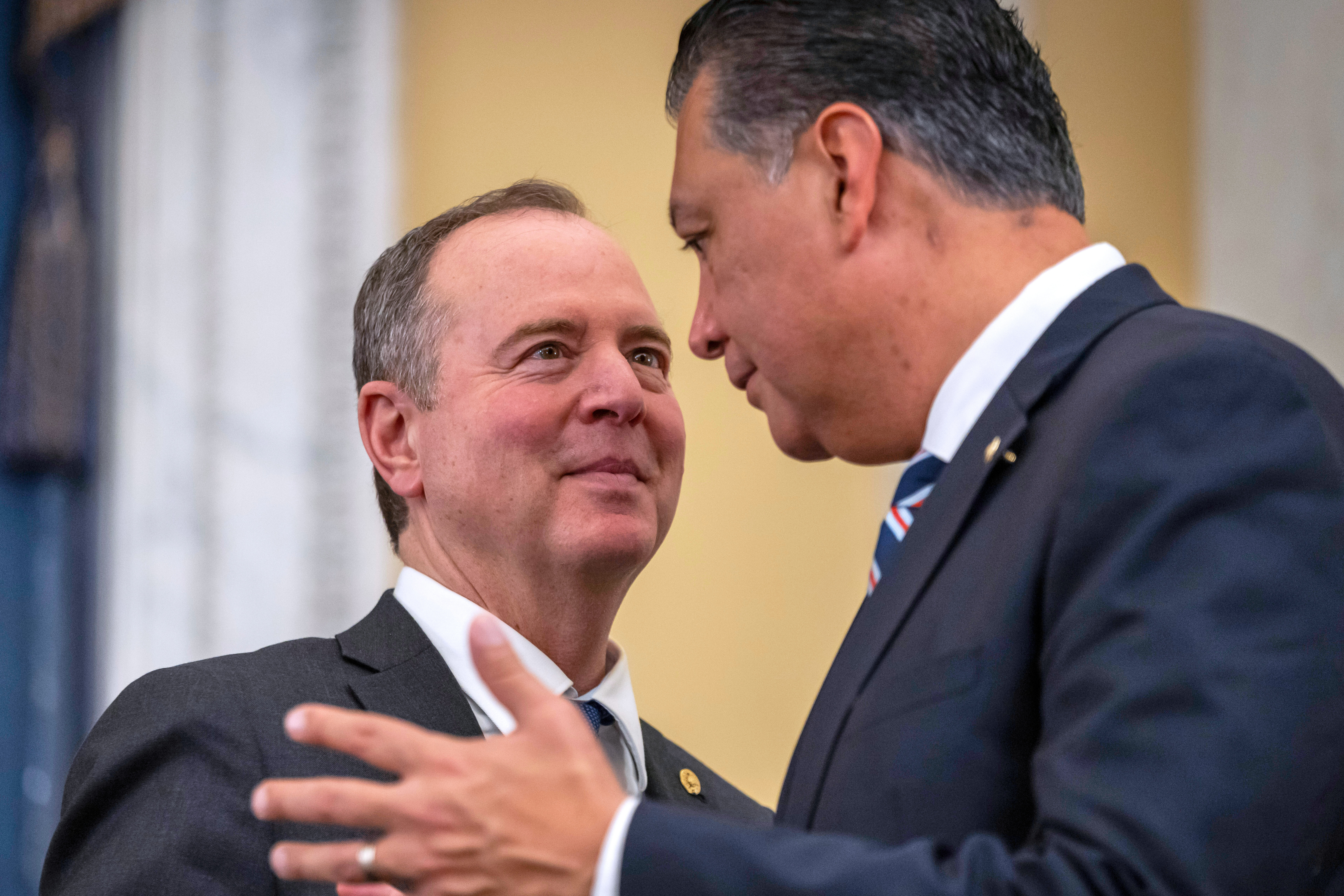 FILE - Sen. Adam Schiff, D-Calif., left, speaks with Sen. Alex Padilla, D-Calif., right, during a Senate hearing, on Capitol Hill in Washington, Dec. 11, 2024. (AP Photo/Ben Curtis, File)