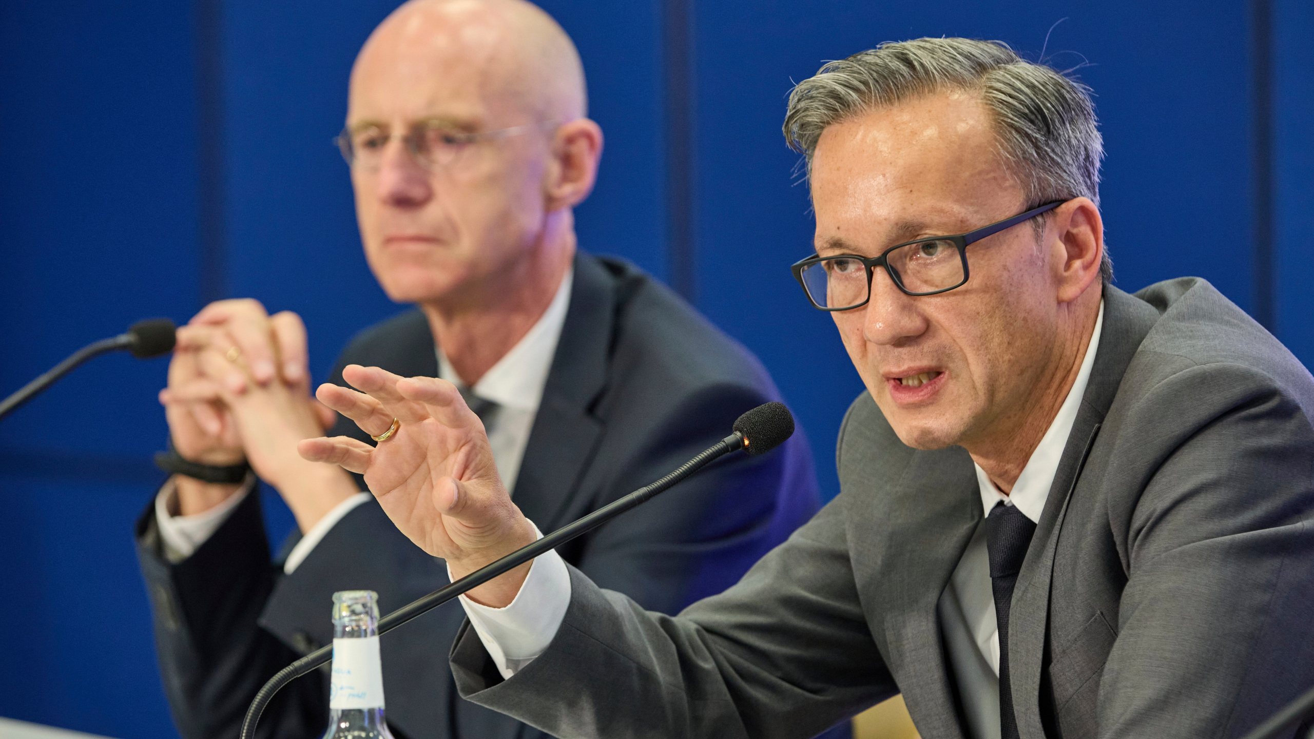 Chief Public Prosecutor Joerg Froehlich, left, and Chief of Police Falk Schnabel give a press conference by the police and Chief Public Prosecutor at police headquarters after a 20-year-old was arrested on suspicion of murdering a child, in Hamburg, Germany, Wednesday, June 18, 2025. (Georg Wendt/dpa via AP)