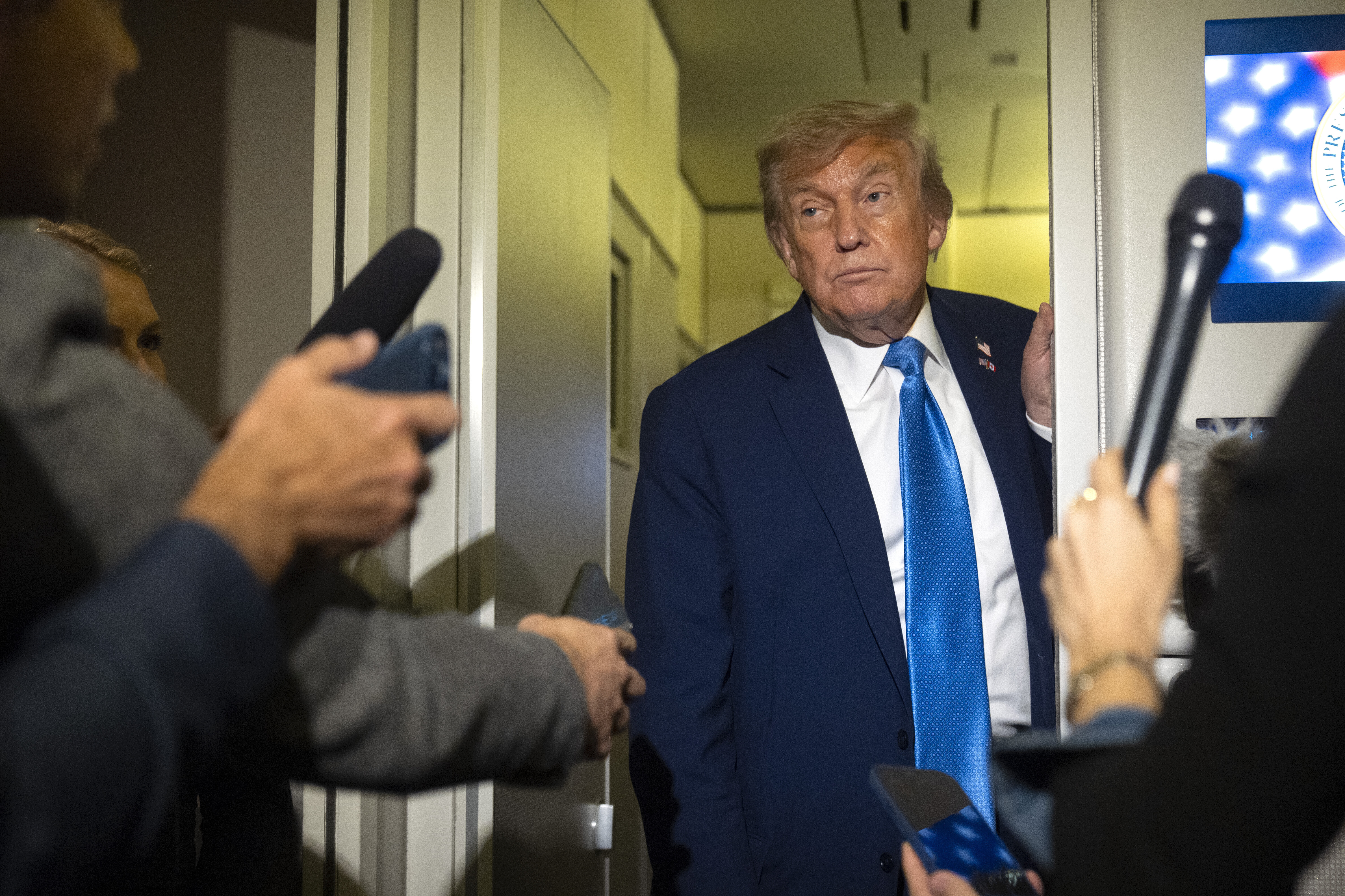 President Donald Trump speaks with reporters while flying aboard Air Force One en route from Calgary, Canada to Joint Base Andrews, Md., late Monday, June 16, 2025. (AP Photo/Mark Schiefelbein)