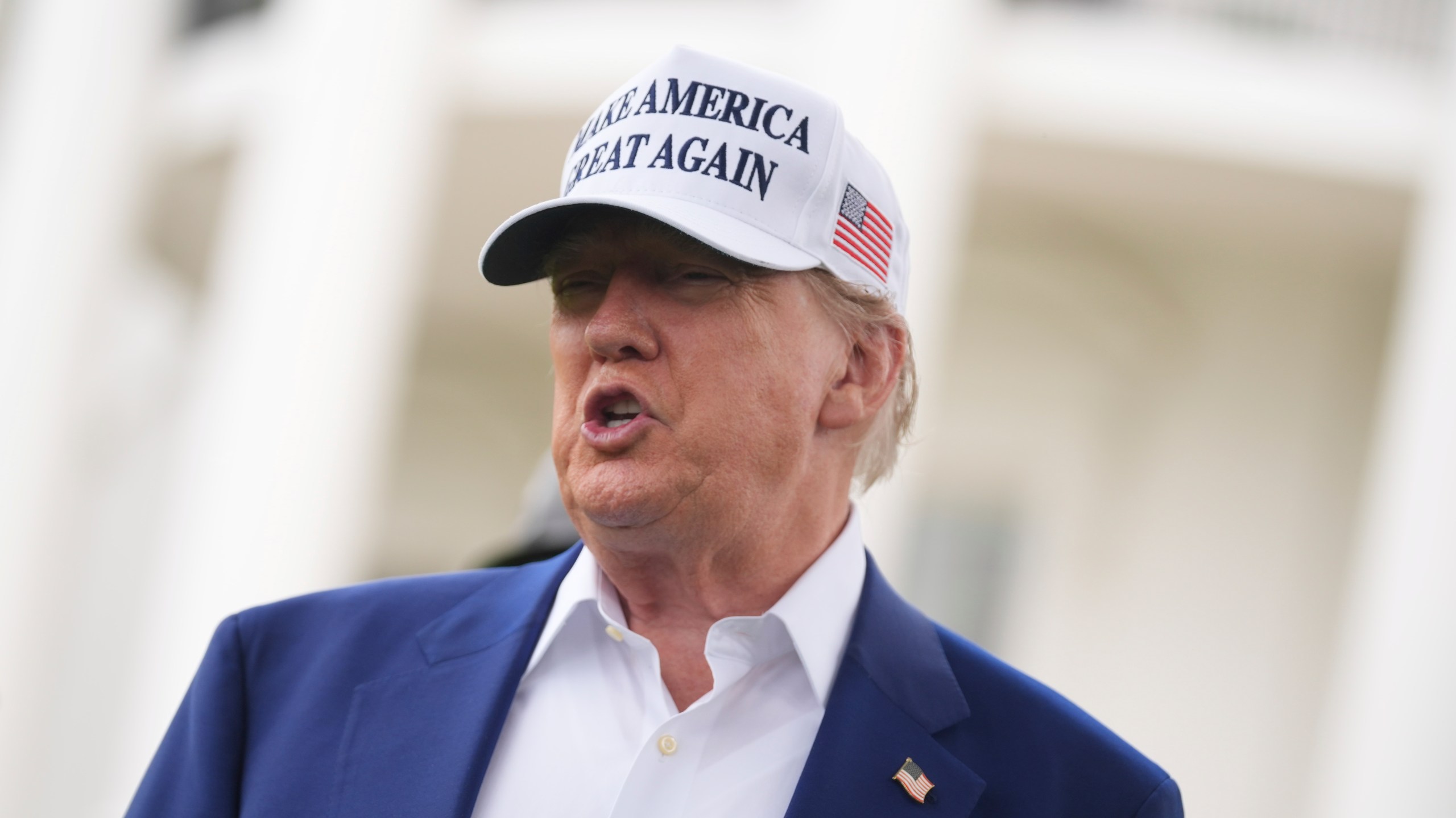 President Donald Trump speaks as a flag pole is installed on the South Lawn of the White House, Wednesday, June 18, 2025, in Washington. (AP Photo/Evan Vucci)