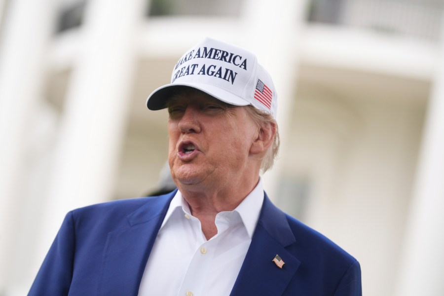 President Donald Trump speaks as a flag pole is installed on the South Lawn of the White House, Wednesday, June 18, 2025, in Washington. (AP Photo/Evan Vucci)
