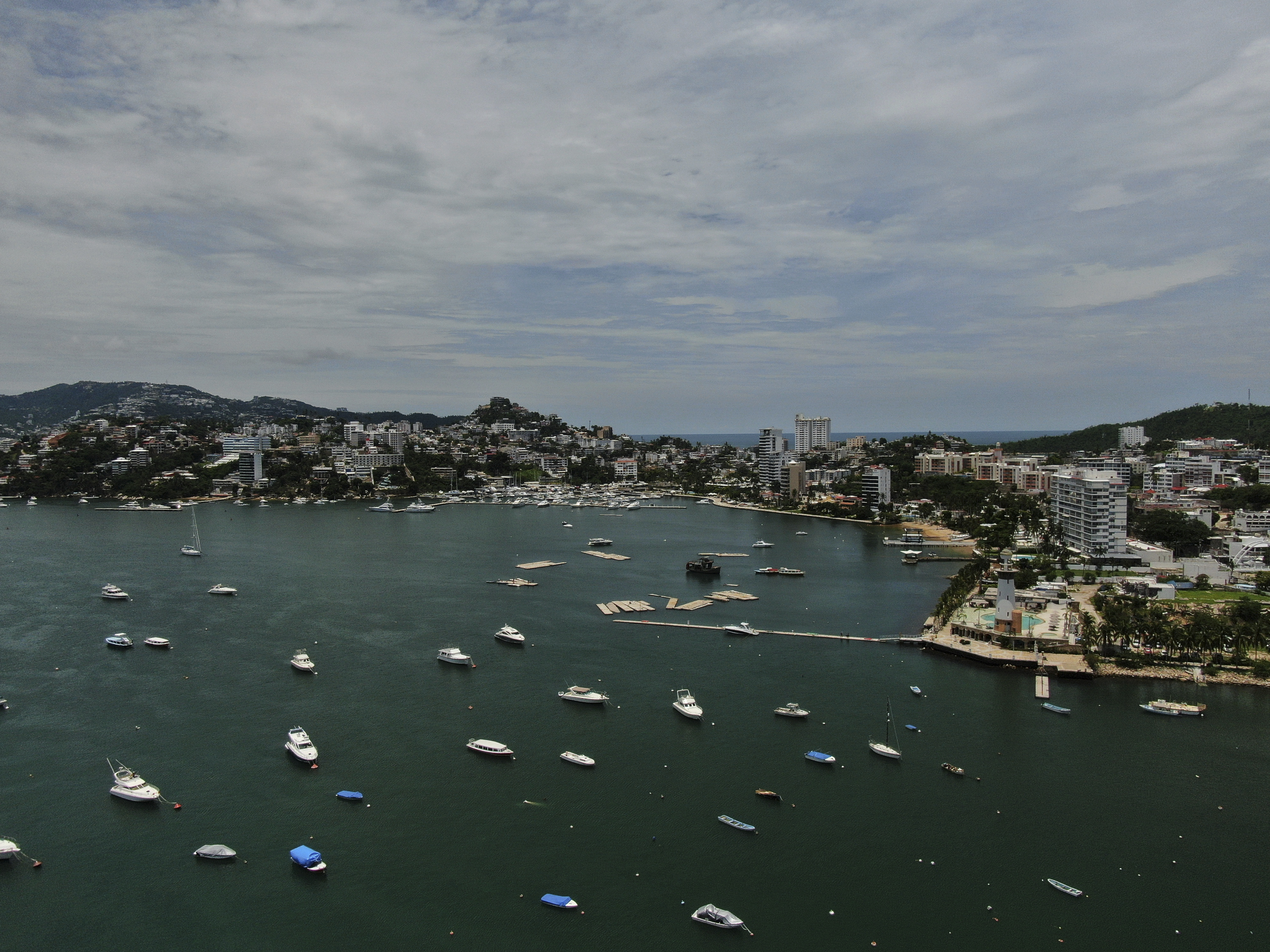 Boats are anchored near Manzanillo beach to be removed from the water ahead of the arrival of Hurricane Erick in Acapulco, Mexico, Wednesday, June 18, 2025. (AP Photo/Fernando Llano)