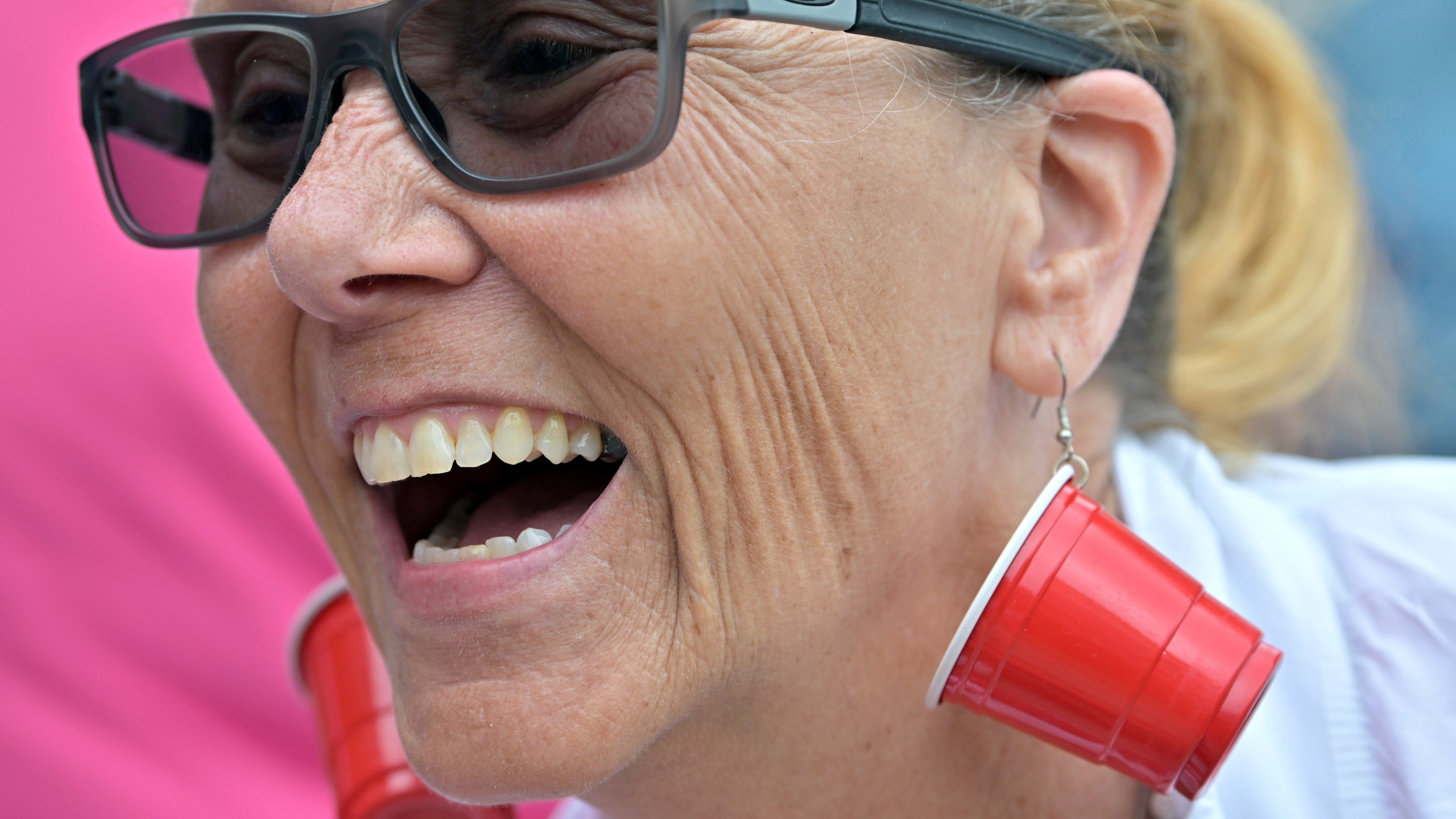 Karen Read supporter Bonnie Fitzgibbon of Chelmsford, MA, wears earrings mocking the investigation into the death of John O'Keefe outside the courthouse on the third day of jury deliberations in Read's trial at Norfolk Superior Court, Wednesday, June 18, 2025, in Dedham, Mass. (AP Photo/Josh Reynolds)