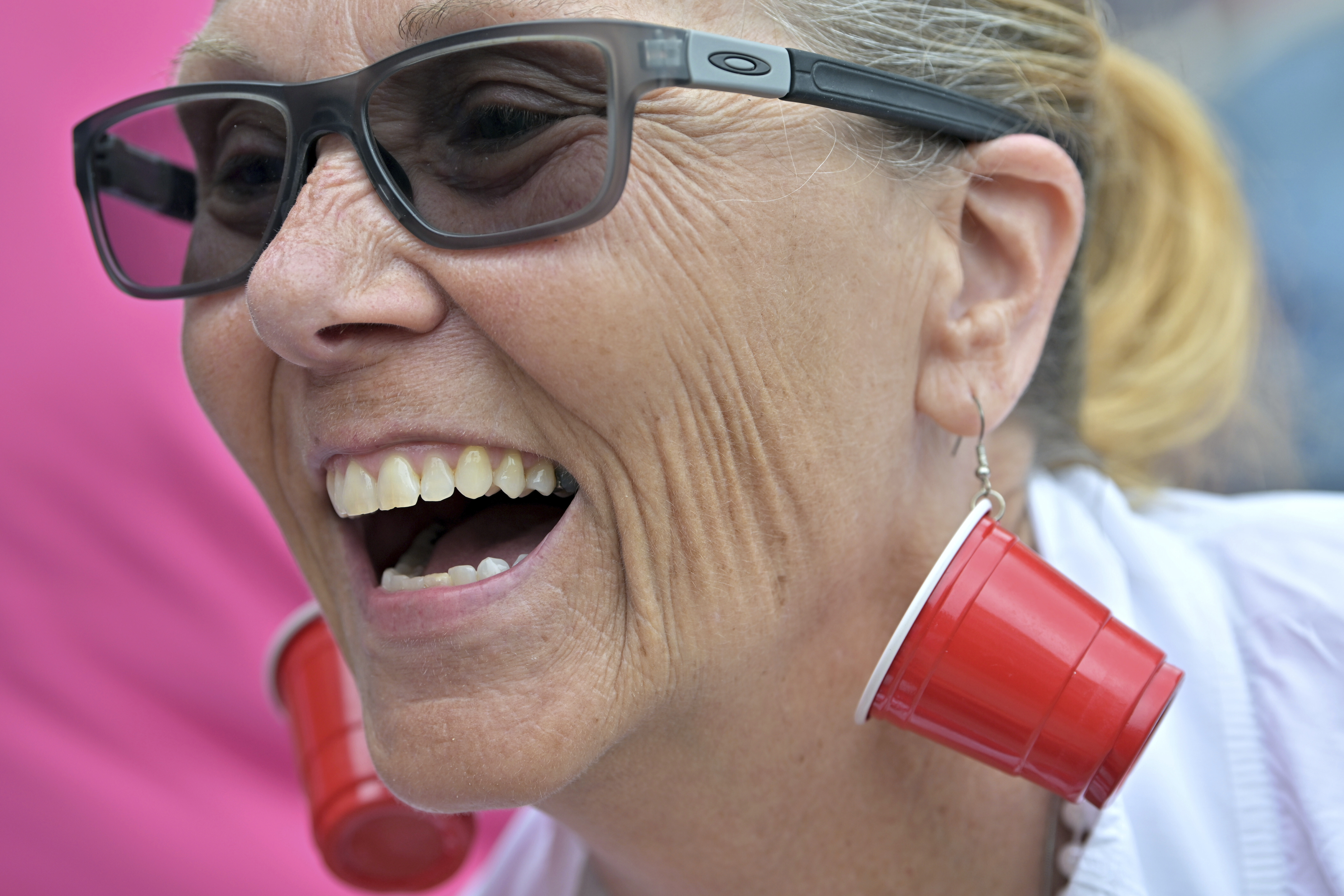 Karen Read supporter Bonnie Fitzgibbon of Chelmsford, MA, wears earrings mocking the investigation into the death of John O'Keefe outside the courthouse on the third day of jury deliberations in Read's trial at Norfolk Superior Court, Wednesday, June 18, 2025, in Dedham, Mass. (AP Photo/Josh Reynolds)