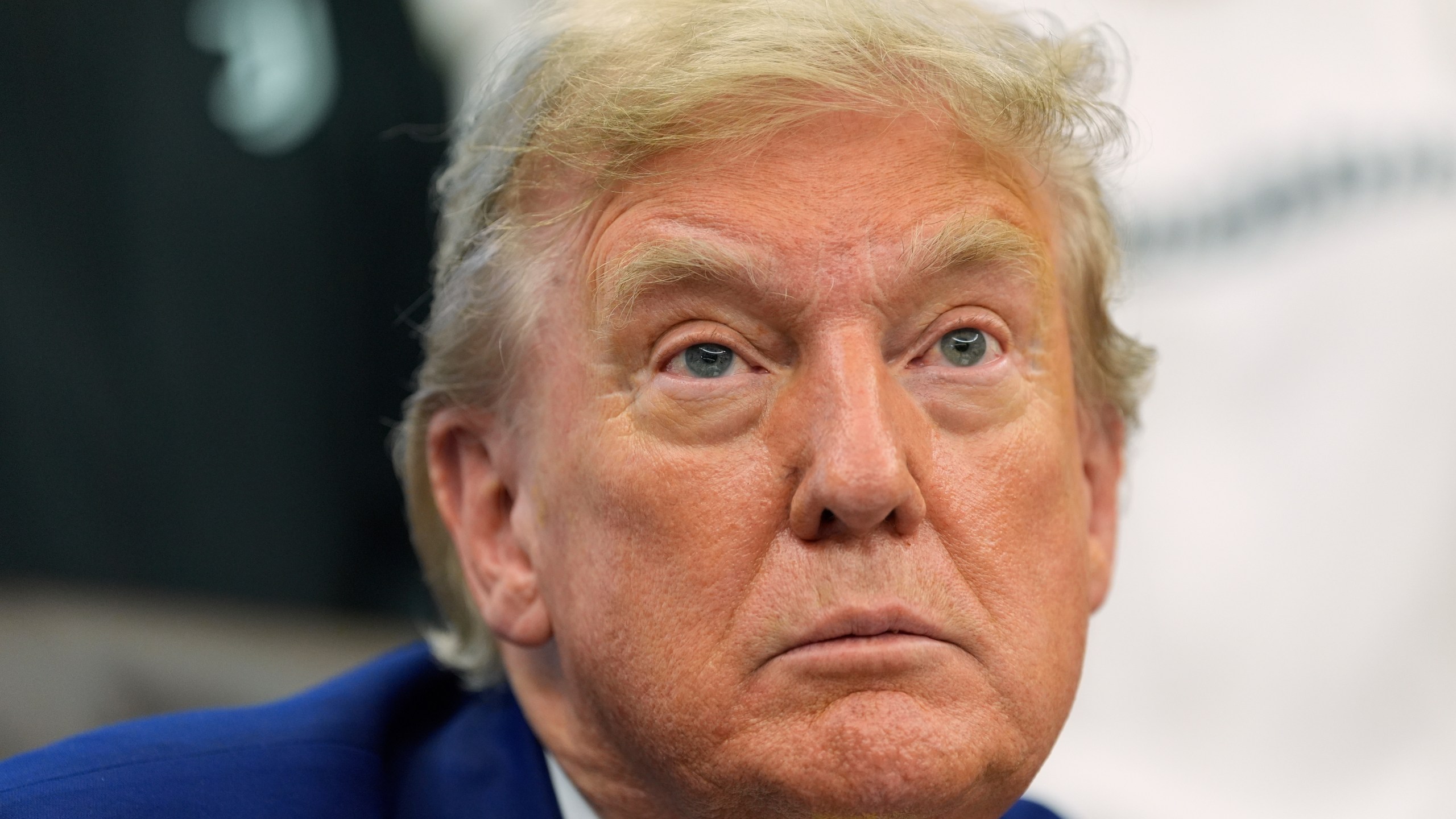 President Donald Trump talks with reporters as he meets with members of the Juventus soccer club in the Oval Office of the White House, Wednesday, June 18, 2025, in Washington. (AP Photo/Alex Brandon)