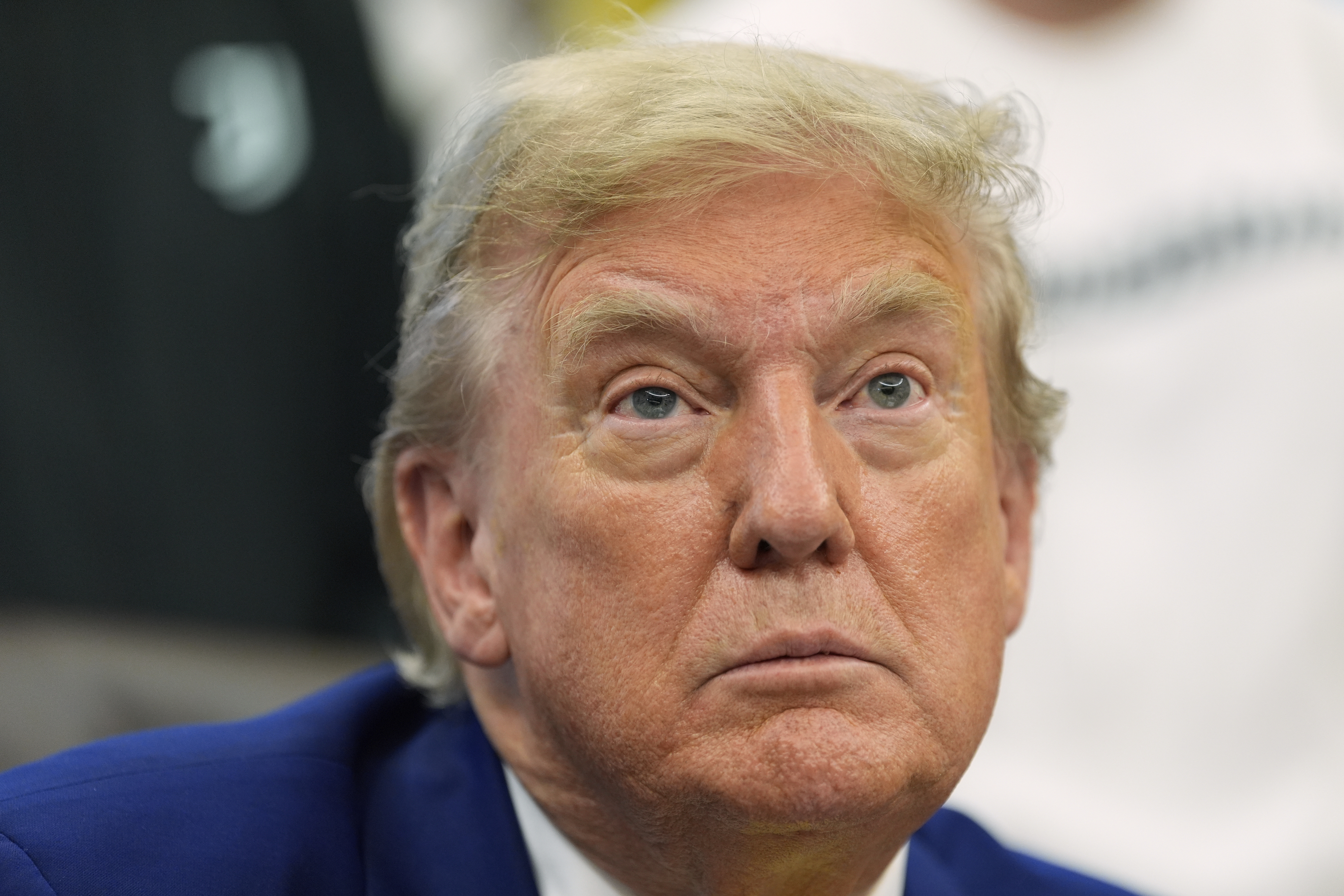 President Donald Trump talks with reporters as he meets with members of the Juventus soccer club in the Oval Office of the White House, Wednesday, June 18, 2025, in Washington. (AP Photo/Alex Brandon)