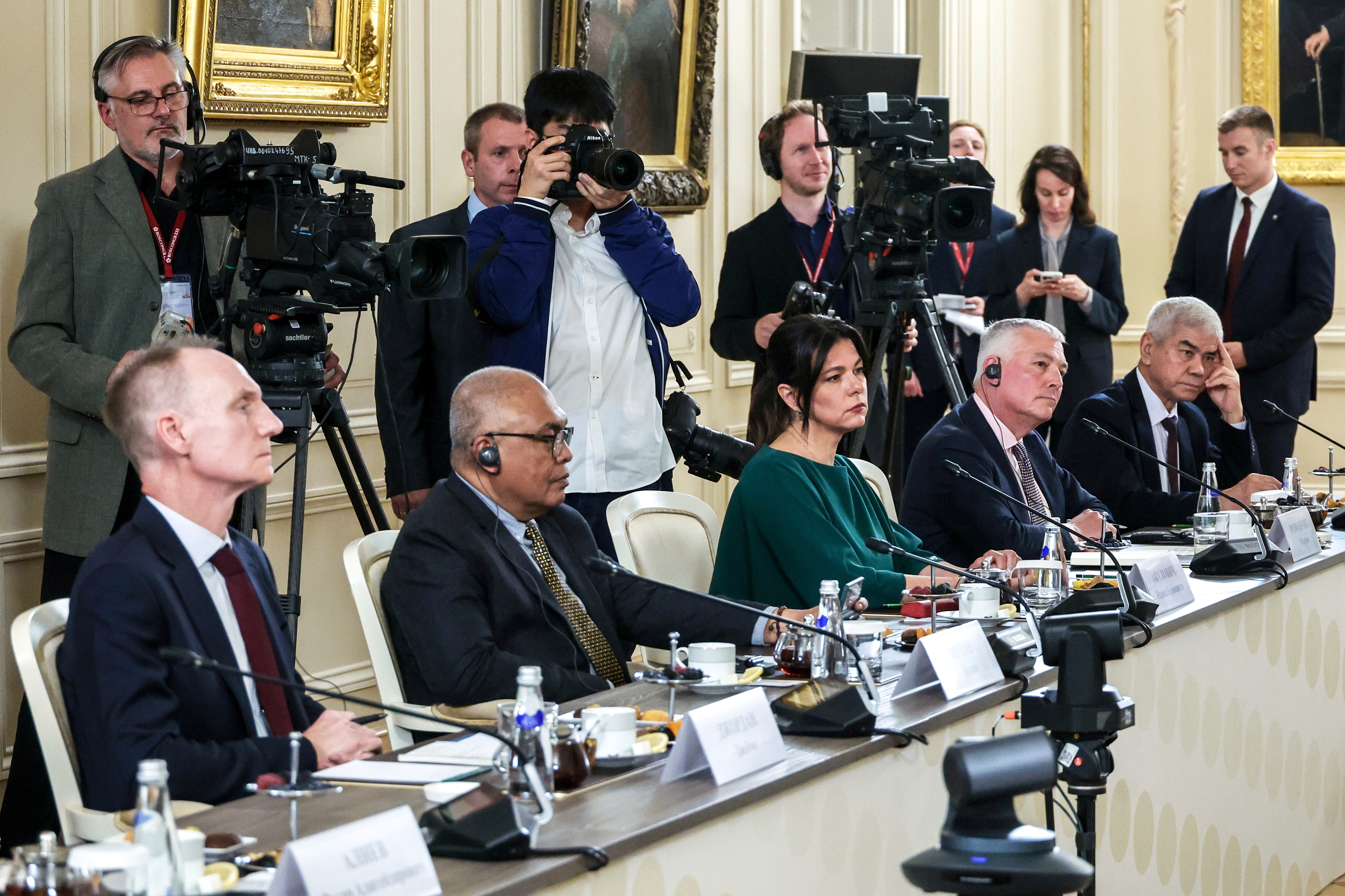 From left, The Associated Press News Director of Europe/Africa James Jordan, ANTARA News Director Akhmad Munir, BELTA Director General Iryna Akulovich, DPA Head of News Service Martin Romanczyk and Uzbekistan National News Agency Director General Abdusaid Kuchimov attend a meeting of Russian President Vladimir Putin with the heads of international news agencies at the newly renovated St. Petersburg Rimsky-Korsakov State Conservatory on the sidelines of the St. Petersburg International Economic Forum in St. Petersburg, Russia, Thursday, June 19, 2025. (Alexander Demyanchuk, Sputnik, Kremlin Pool Photo via AP)
