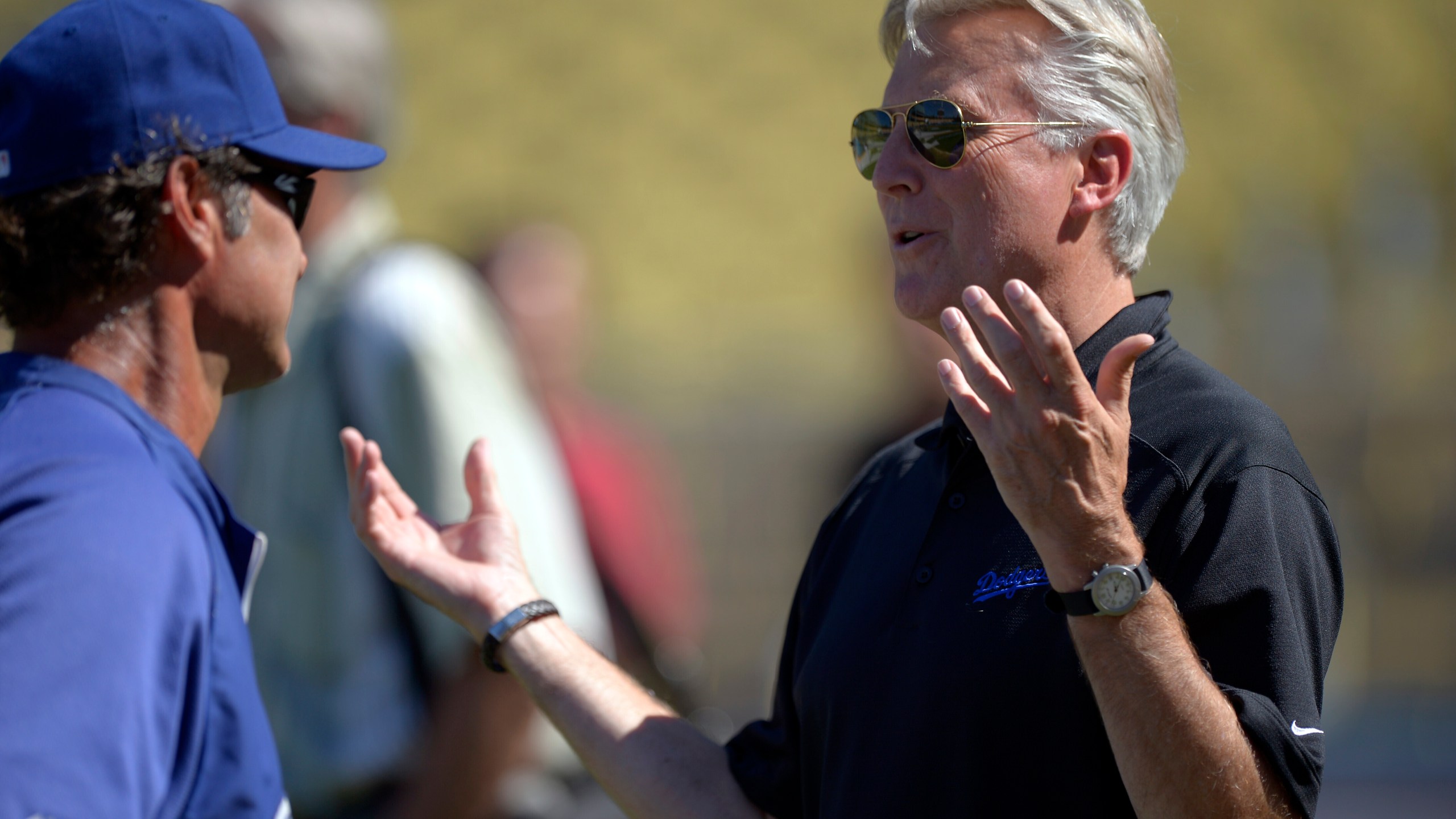 FILE - Los Angeles Dodgers co-owner Mark Walter, right, talks with manager Don Mattingly prior to their baseball game against the San Diego Padres, Sept. 3, 2012, in Los Angeles. (AP Photo/Mark J. Terrill, File)